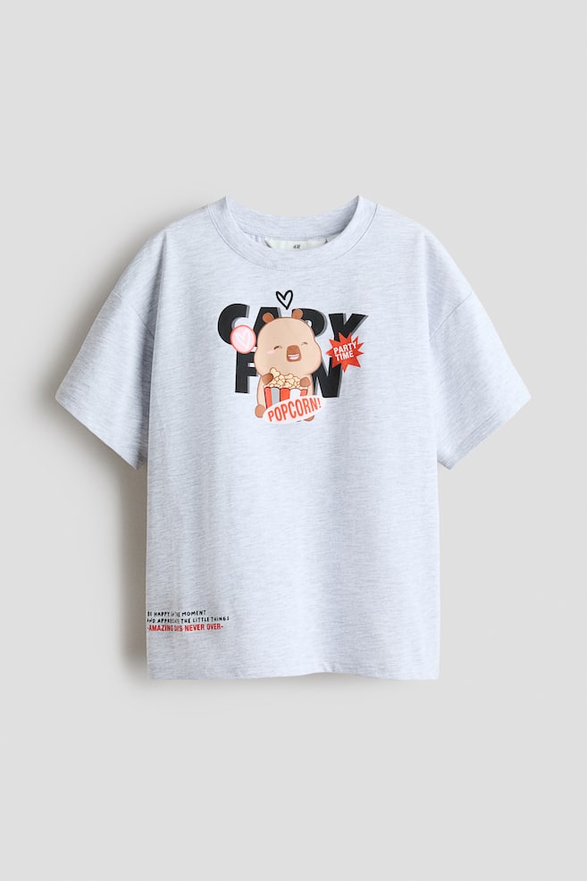 Printed Cotton T-Shirt - Light gray melange/CapyFun/Light blue/Snoopy/White/KPop Demon Hunters/Light pink/SmileyWorld®/Light pink/KPop Demon Hunters/White/KPop Demon Hunters/Gray/KPop Demon Hunters/Light yellow/SmileyWorld® - 1