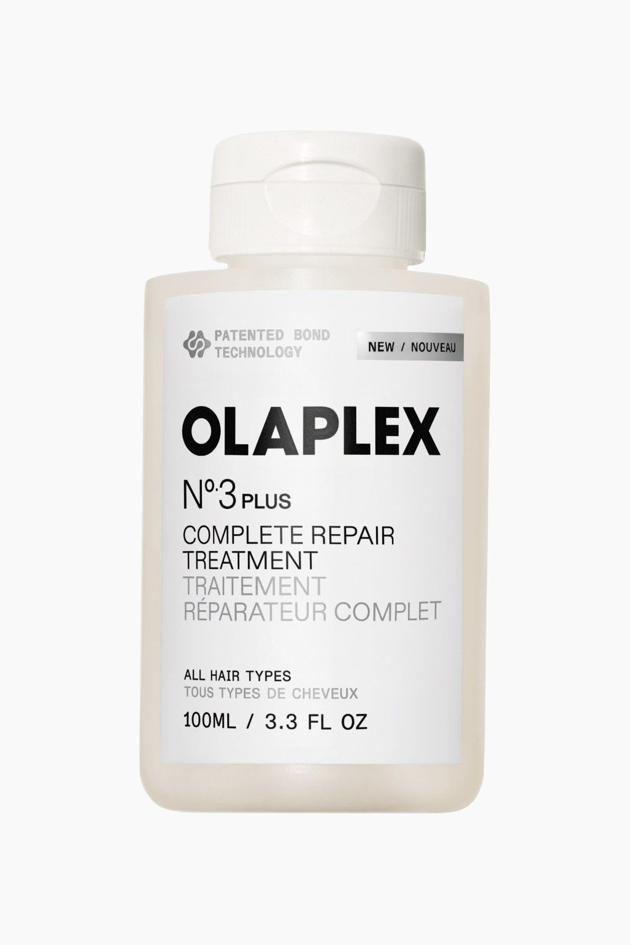 Visa större bild: En flaska Olaplex N°3 Plus Complete Repair Treatment står upprätt, vänd framåt. Denna genomskinliga, off-white rektangulära flaska har rundade hörn, ett vitt flip-top lock och en vit etikett som visar produktnamn och detaljer.