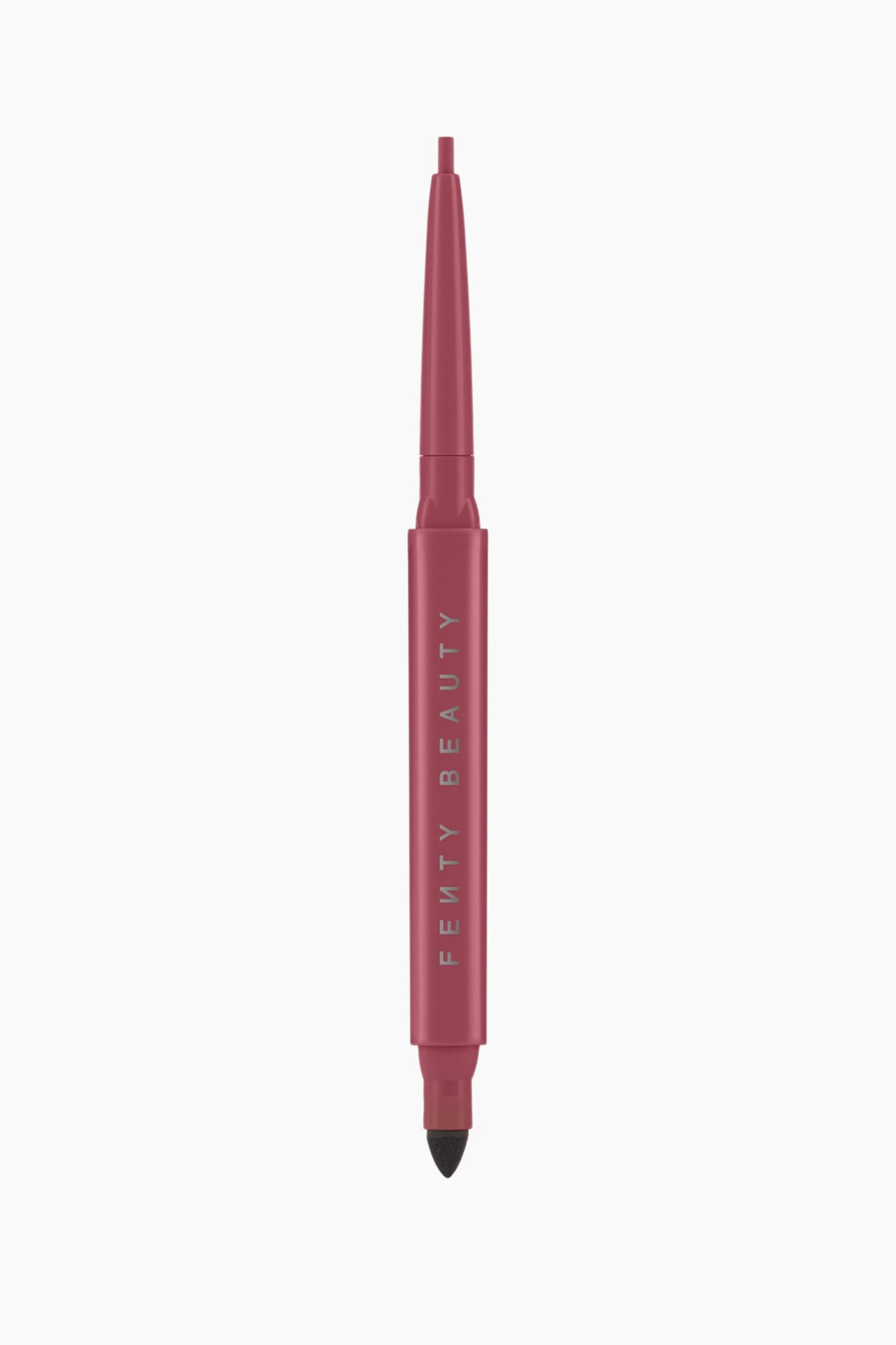 En dubbelÃ¤ndad eyelinerpenna i en dammig rosenrosa nyans stÃ¥r vertikalt och visar upp sin design. Det matta rosafÃ¤rgade skaftet har varumÃ¤rkesnamnet vertikalt i silver, medan den Ã¶vre Ã¤nden visar en utdragbar eyeliner-spets och den nedre Ã¤nden avslÃ¶jar en svart, spetsig smudger av svamp. - 1