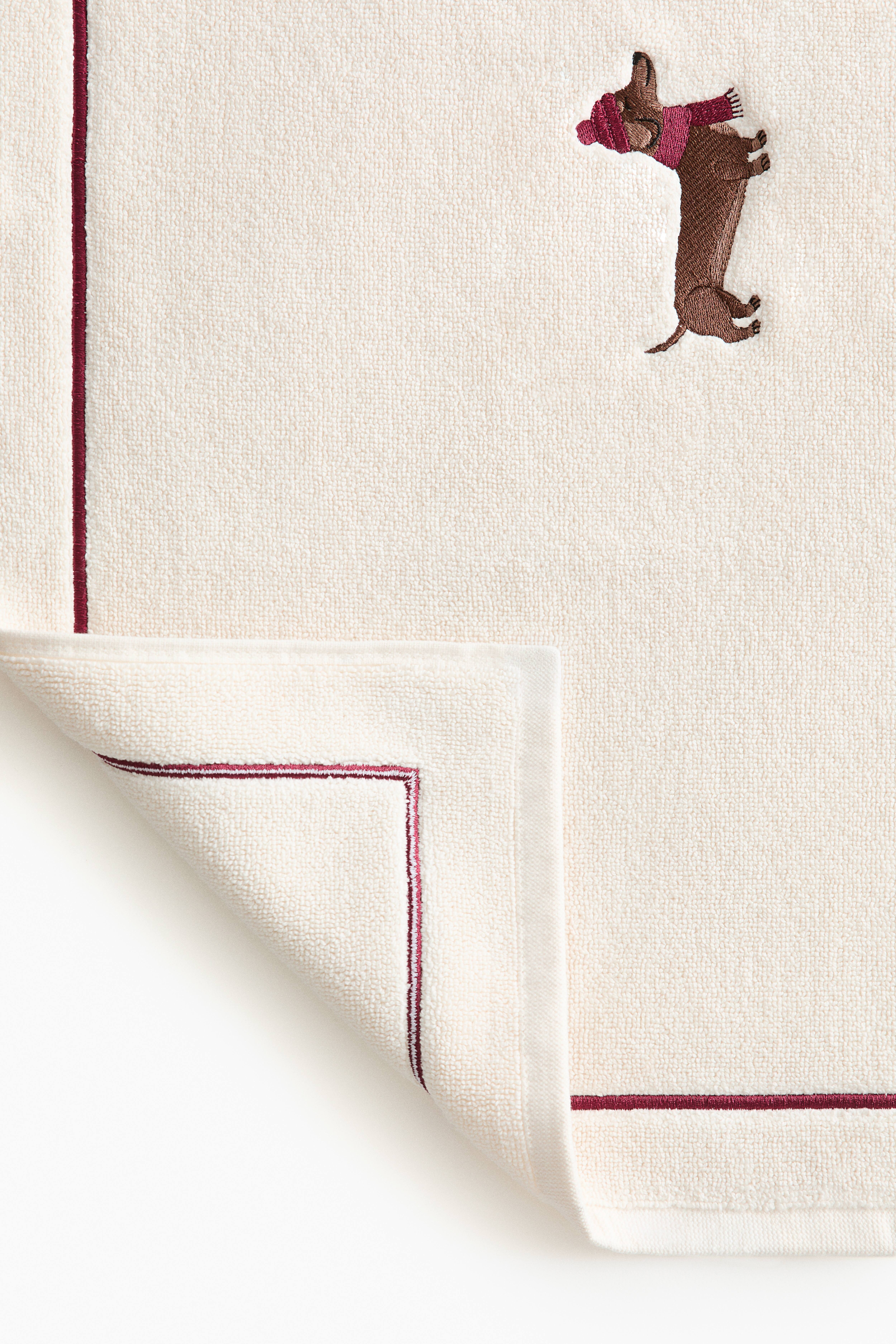 Tapis de bain en coton avec motif brodé
