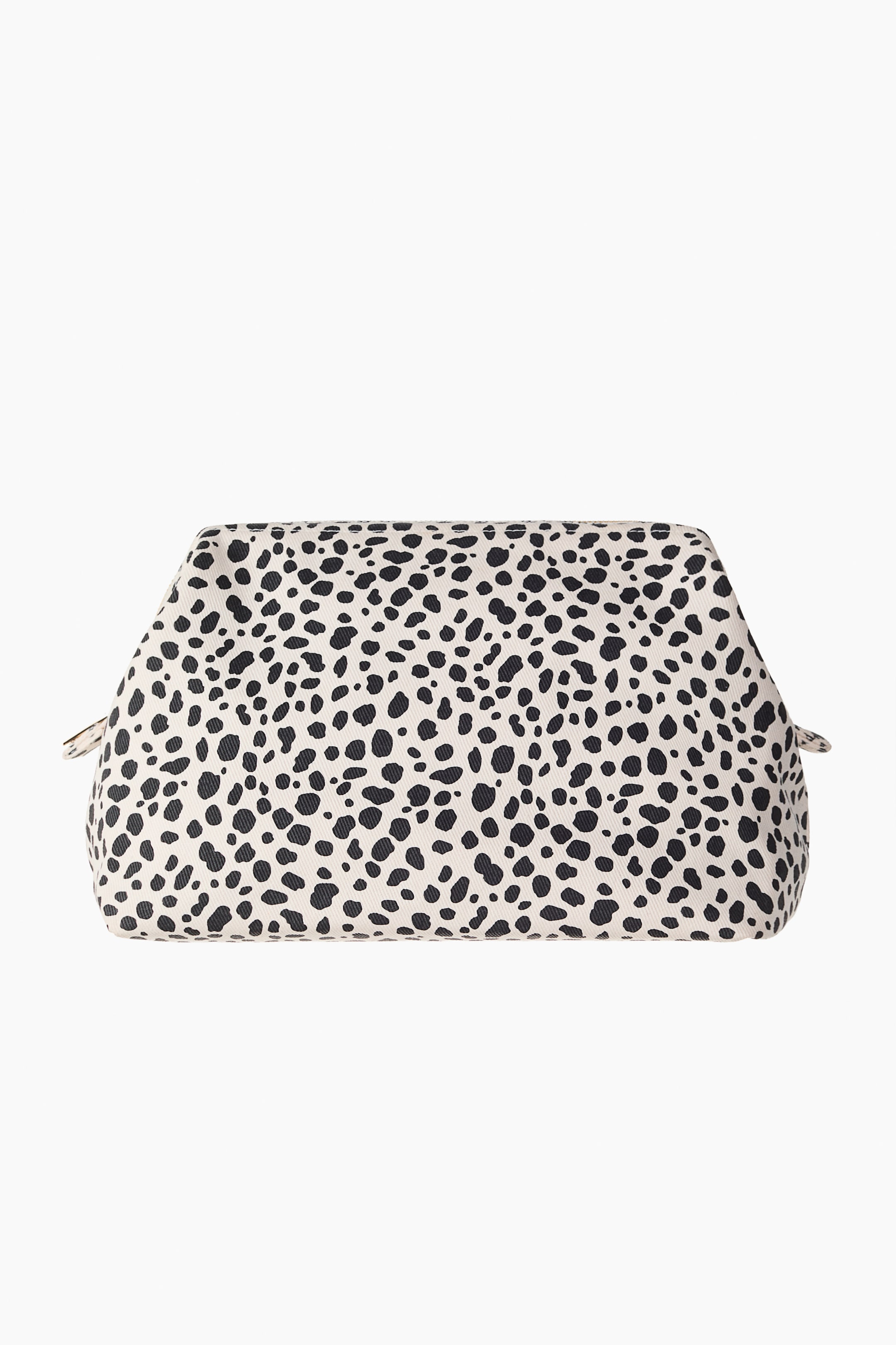 View larger image: A wash bag is shown from the front, boasting a cream base adorned with black irregular spots. It takes on a rectangular shape at the bottom, narrowing towards the zipped top, with a zipper pull tab visible on the left side.