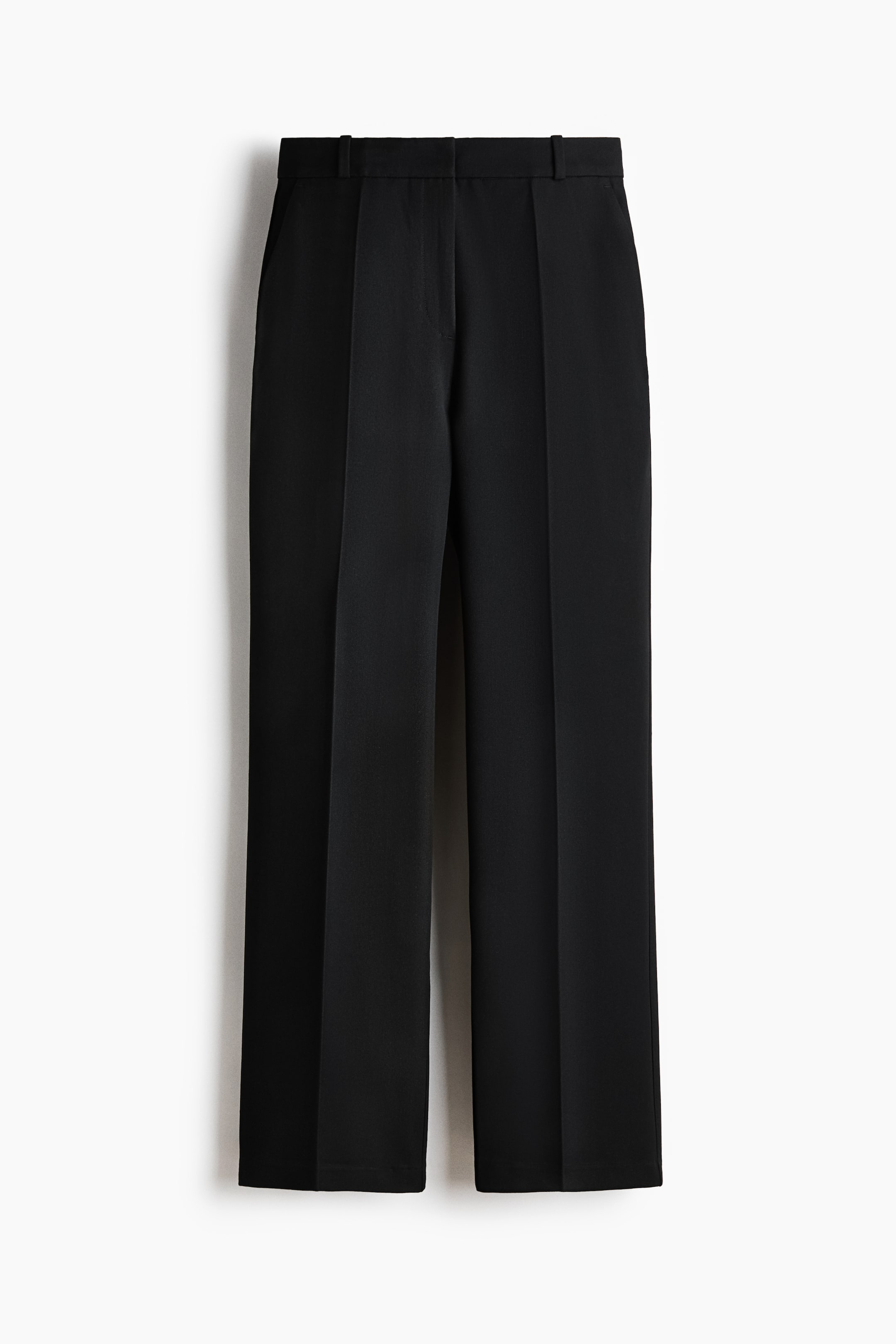 View larger image: Black trousers are shown from the front, featuring a flat waistband with belt loops and pressed creases running down the center of each straight leg.