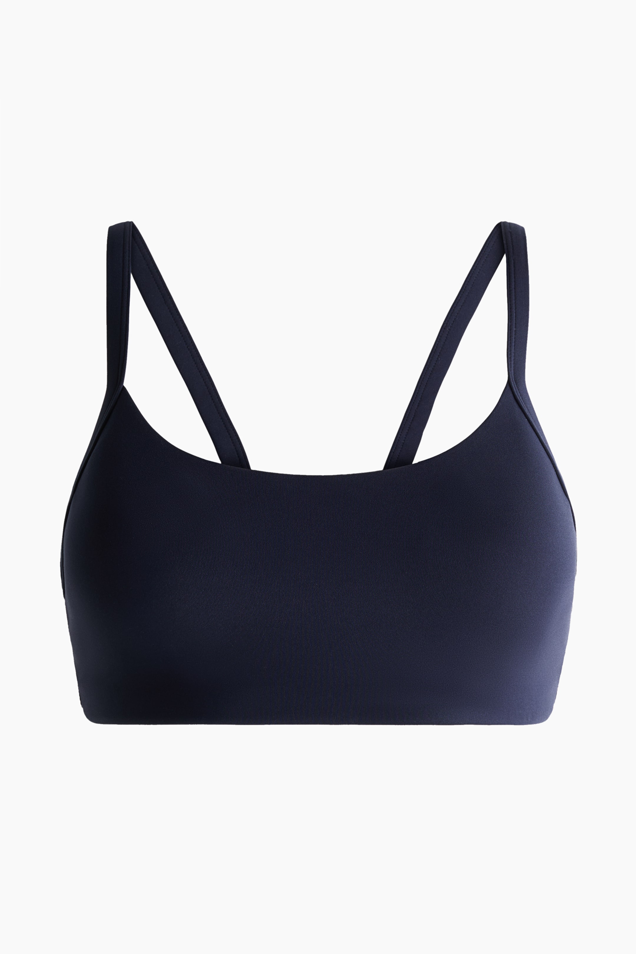 Ingrandisci l'immagine: Reggiseno sportivo a medio supporto in blu scuro con SoftMove, caratterizzato da uno scollo rotondo, spalline doppie sottili e una fascia sottoseno larga e piatta, presentato frontalmente.