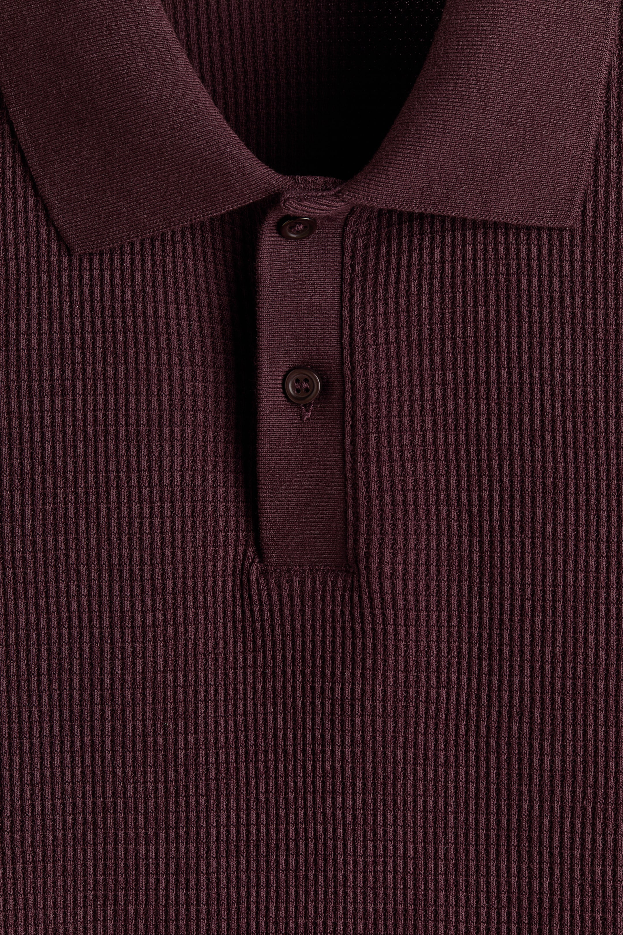 Polo près du corps en tricot gaufré