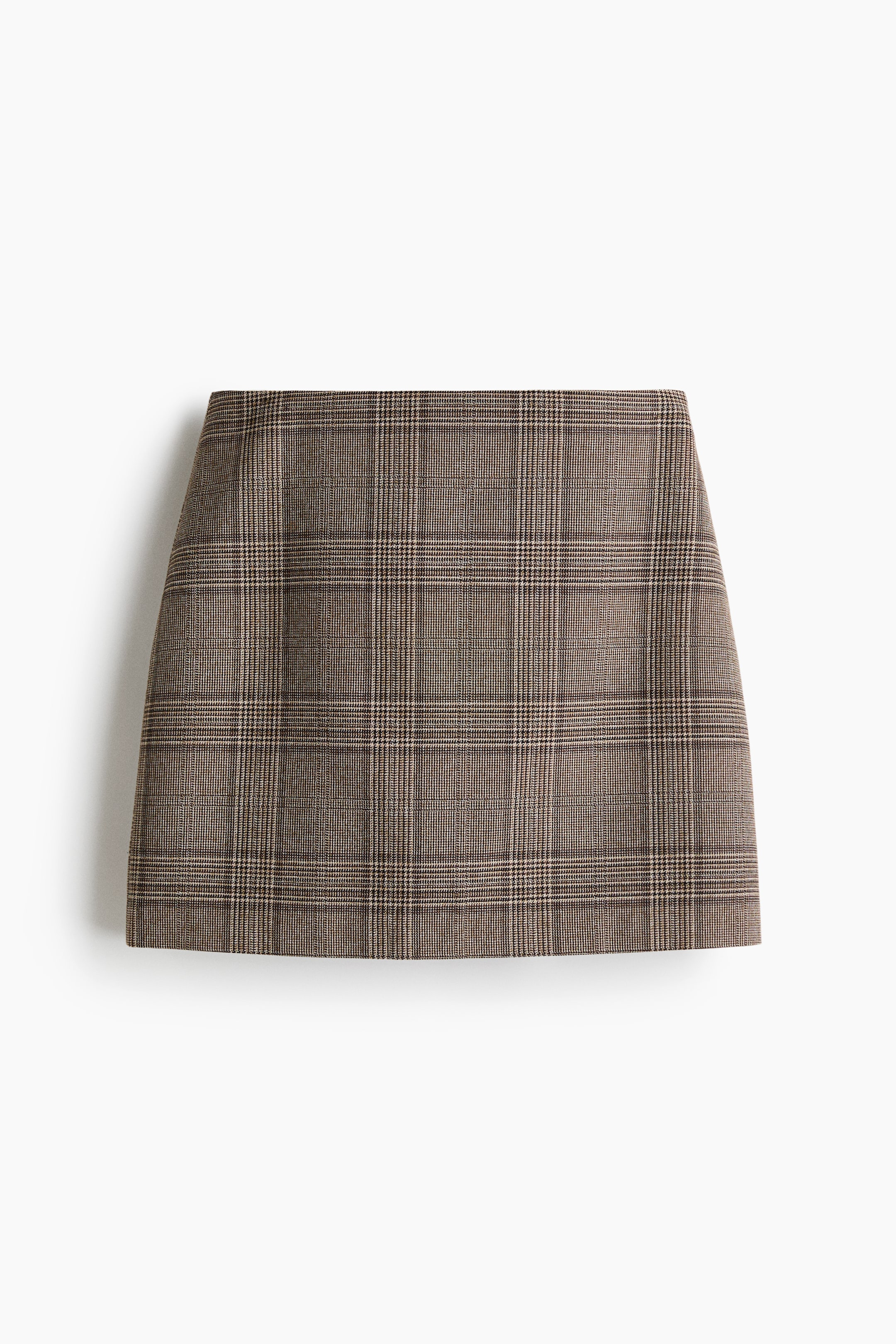 View larger image: A mini A-line skirt is facing front, displaying a brown, black, and beige plaid pattern.