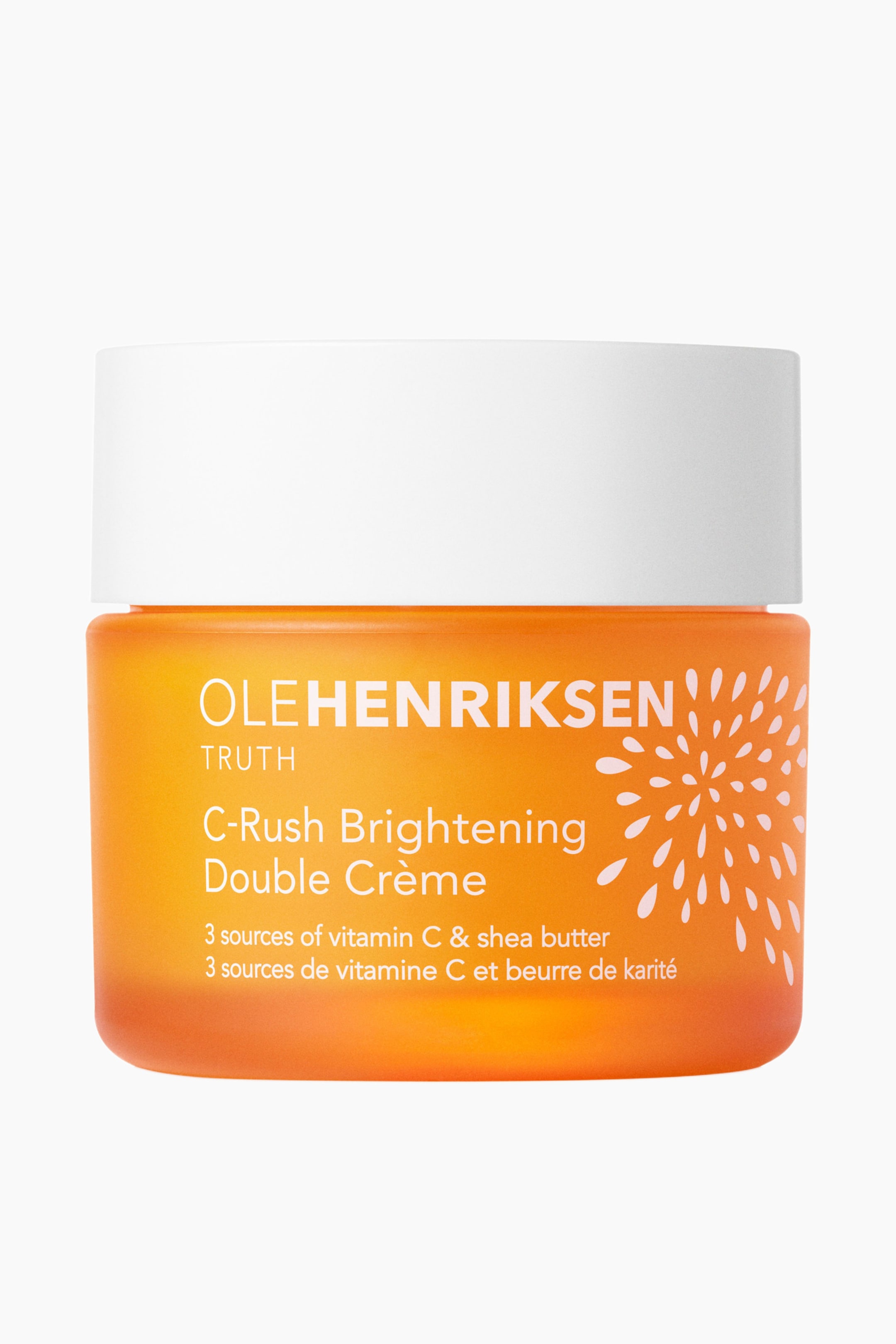 Se større billede: En Ole Henriksen C-Rush Brightening Double Crème-krukke står oprejst og vender fremad. Den har en orange gradient-krop med hvid tekst og et hvidt stjerneskud-design og er toppet med et hvidt låg.