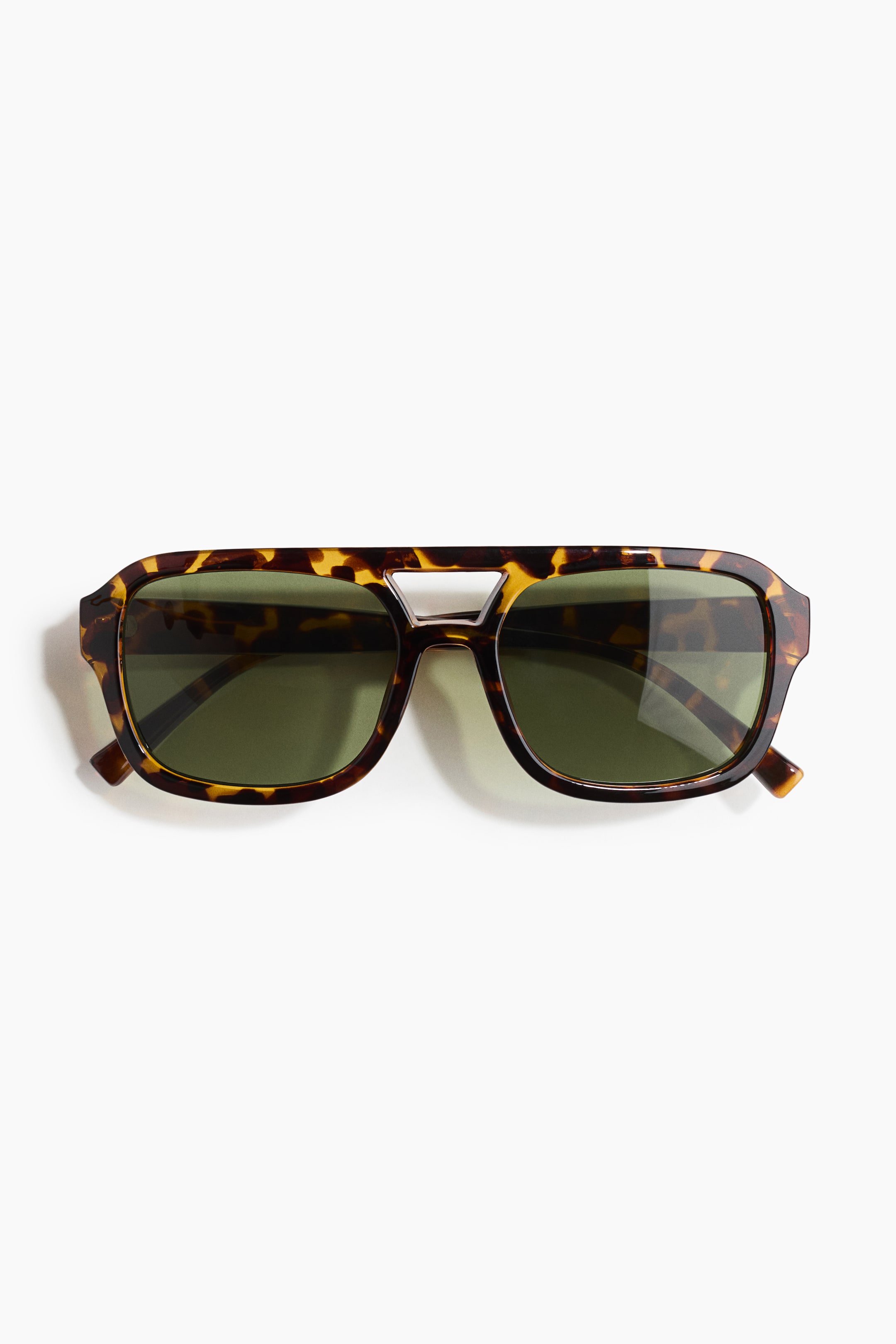 View larger image: Aviator-style sunglasses feature tortoiseshell plastic frames with dark green, UV-protective tinted lenses. A double bridge design connects the top of the frames, presented from the front.