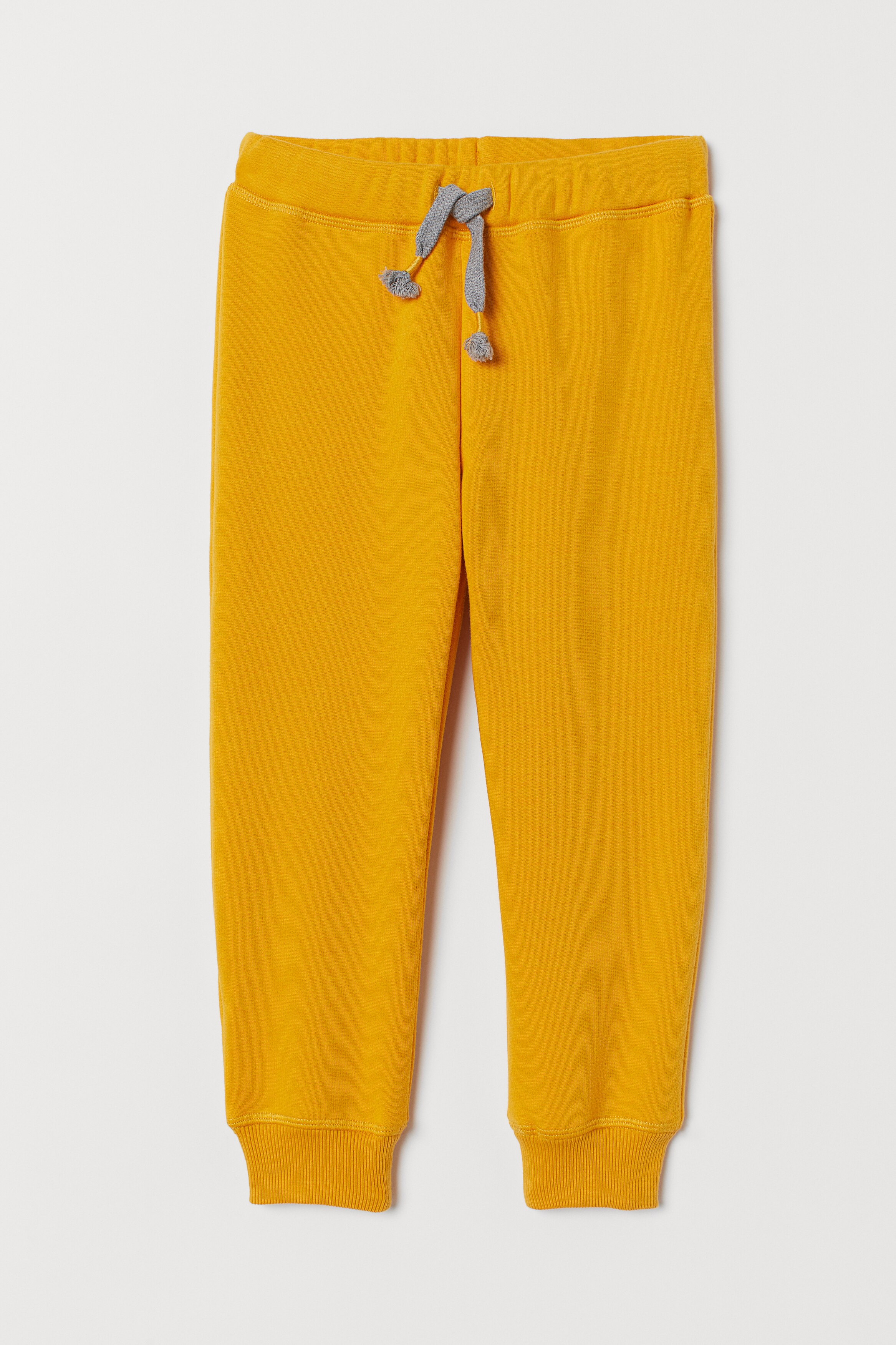 H&m yellow joggers sale