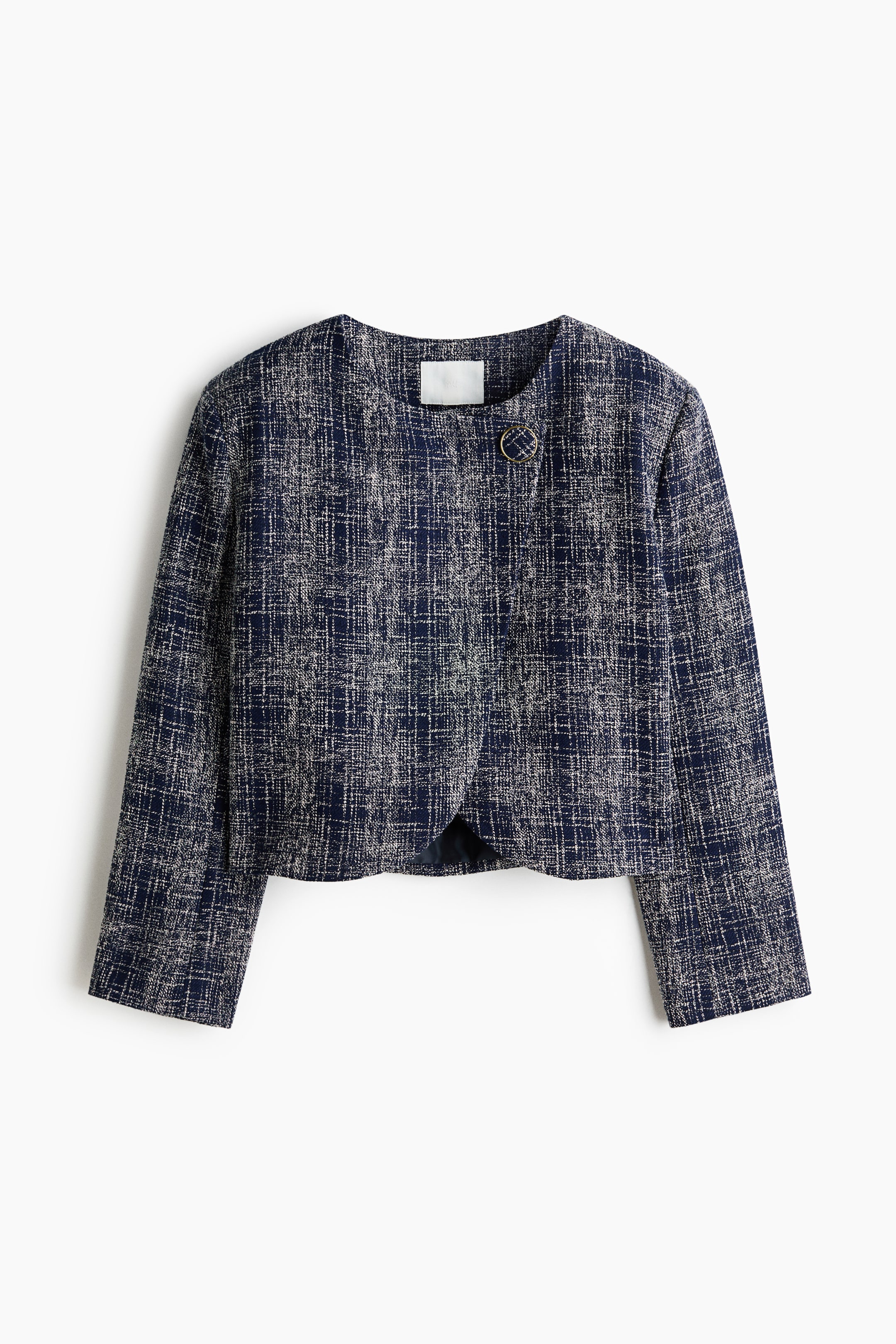 View larger image: The jacket showcases a navy and off-white woven texture in a FRONT view. It features a round, collarless neckline, a decorative circular button on the upper right, and a curved, open front hem.