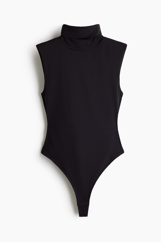 A black sleeveless bodysuit is facing front, showcasing a high turtleneck and structured, slightly padded shoulders. The garment is featuring a fitted silhouette that tapers down to a high-cut thong bottom. - 1
