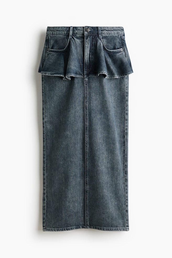 A dark wash blue denim midi skirt showcases a straight silhouette from the front. It features a ruffled peplum waistline with a button closure, belt loops, and front scoop pockets, while a prominent center seam runs down the skirt's length. - 1