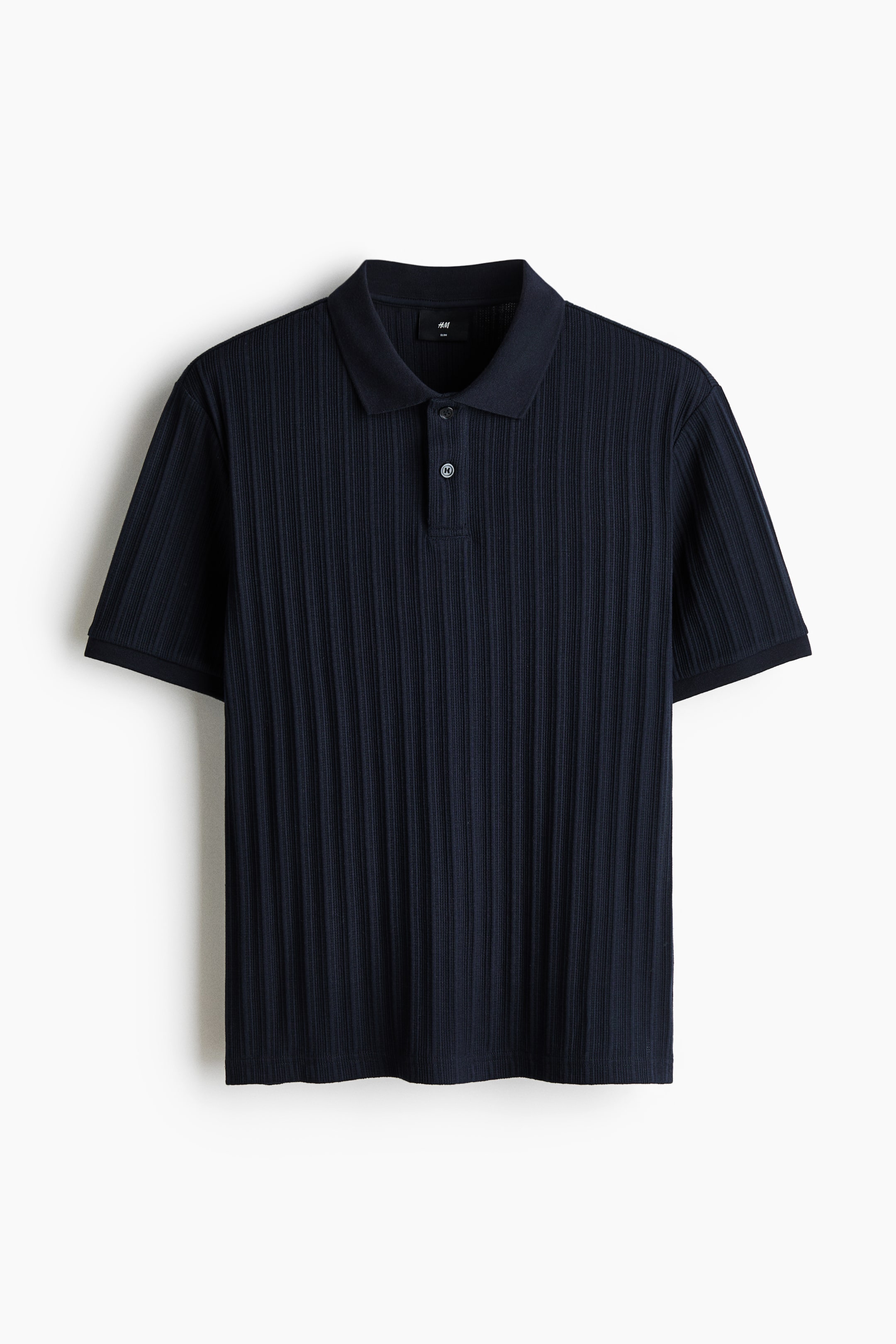 View larger image: A dark blue polo shirt is displaying its FRONT, featuring a textured, vertically ribbed midweight jersey fabric. 