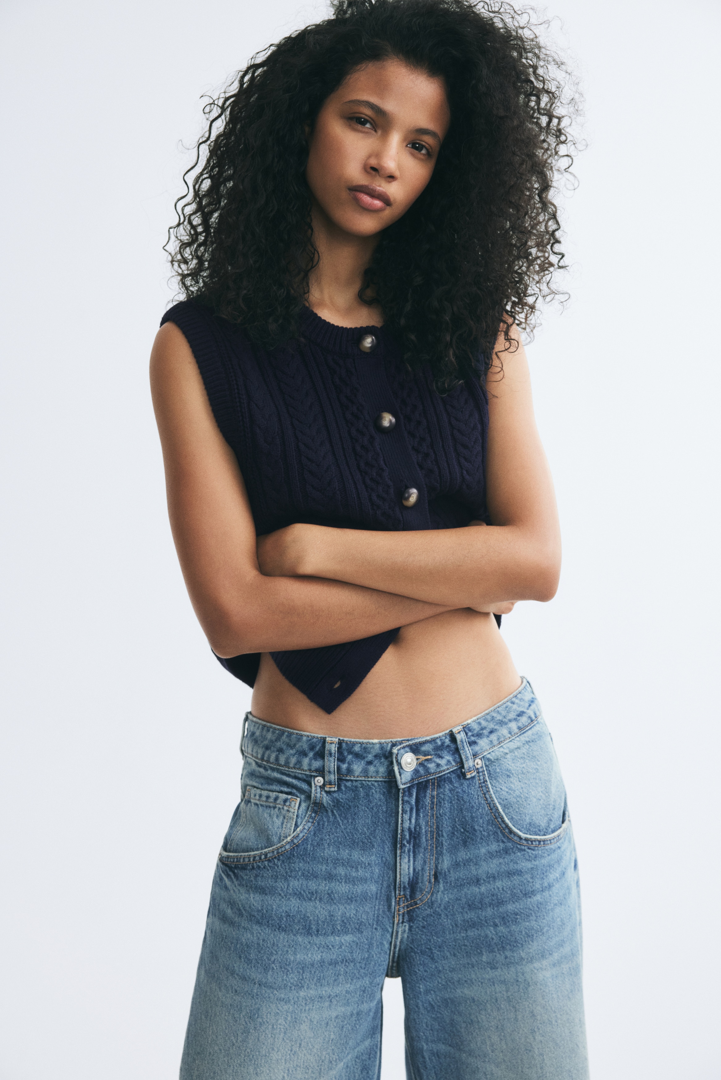 Cable-knit sweater vestModel