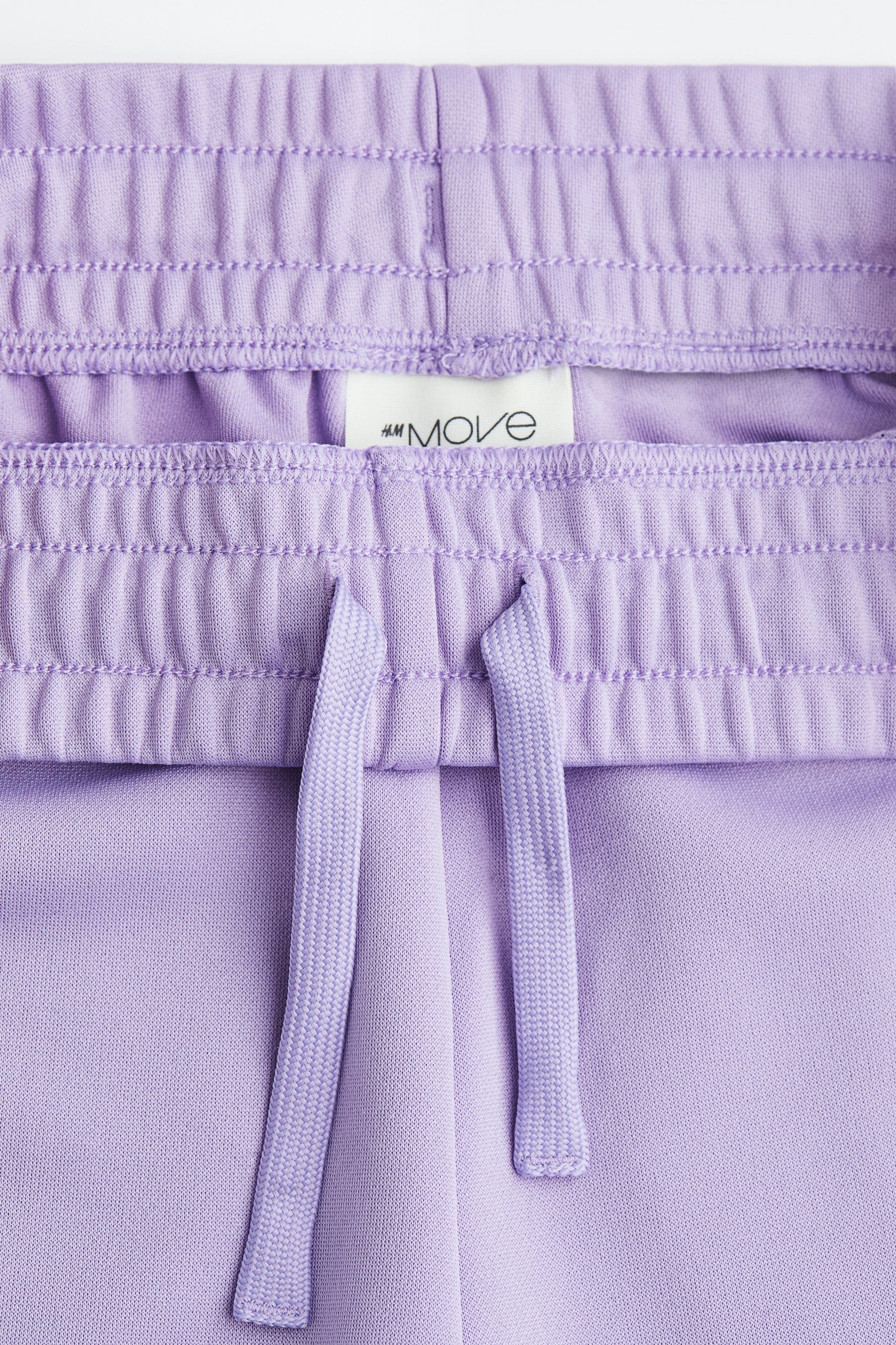 Ver imagem maior: Calças de desporto largas em DryMove™ - Lilás claro - CRIANÇA | H&M PT 3