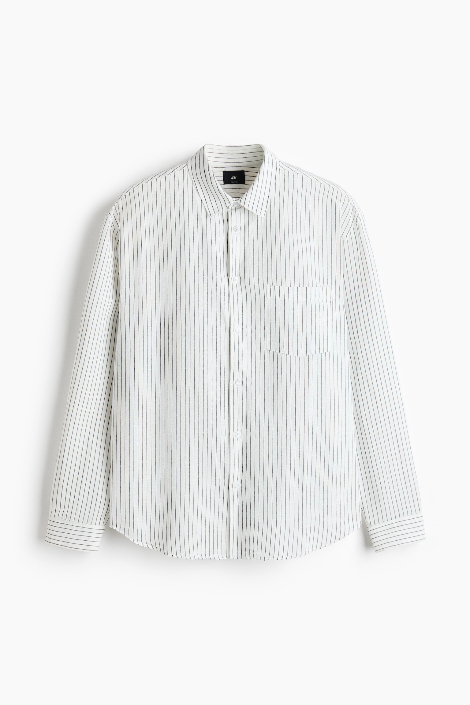 The shirt showcases its front, featuring a white cotton and linen weave with fine dark vertical stripes. It is designed with a turn-down collar, a French front, an open chest pocket on the left, long sleeves with adjustable buttoning at the cuffs, and a rounded hem, conveying a relaxed fit. - 1