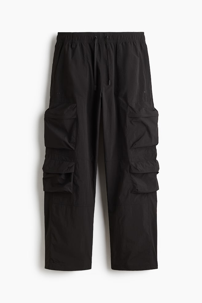 Wasserabweisende Cargohose in Loose Fit - Schwarz/Grün - 1