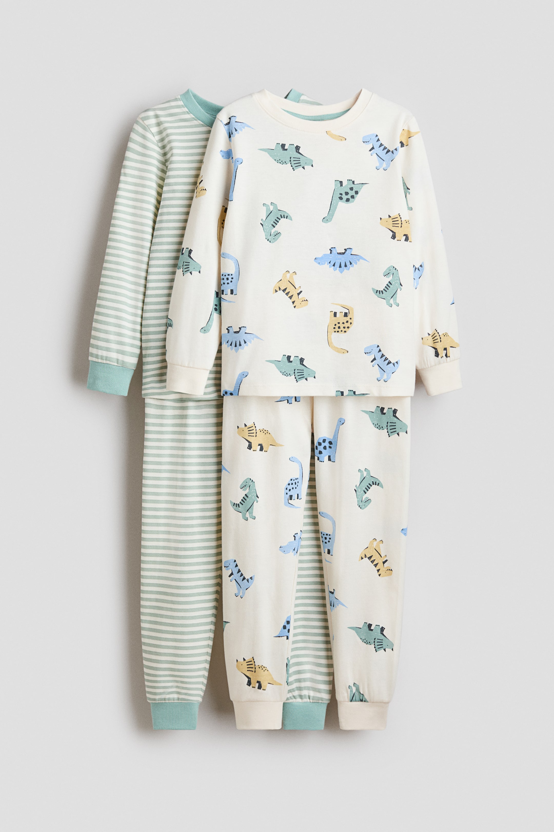 Ver imagen más grande: Pack de 2 pijamas de algodón con estampado - Turquesa claro/Dinosaurios - NIÑOS | H&M ES 1