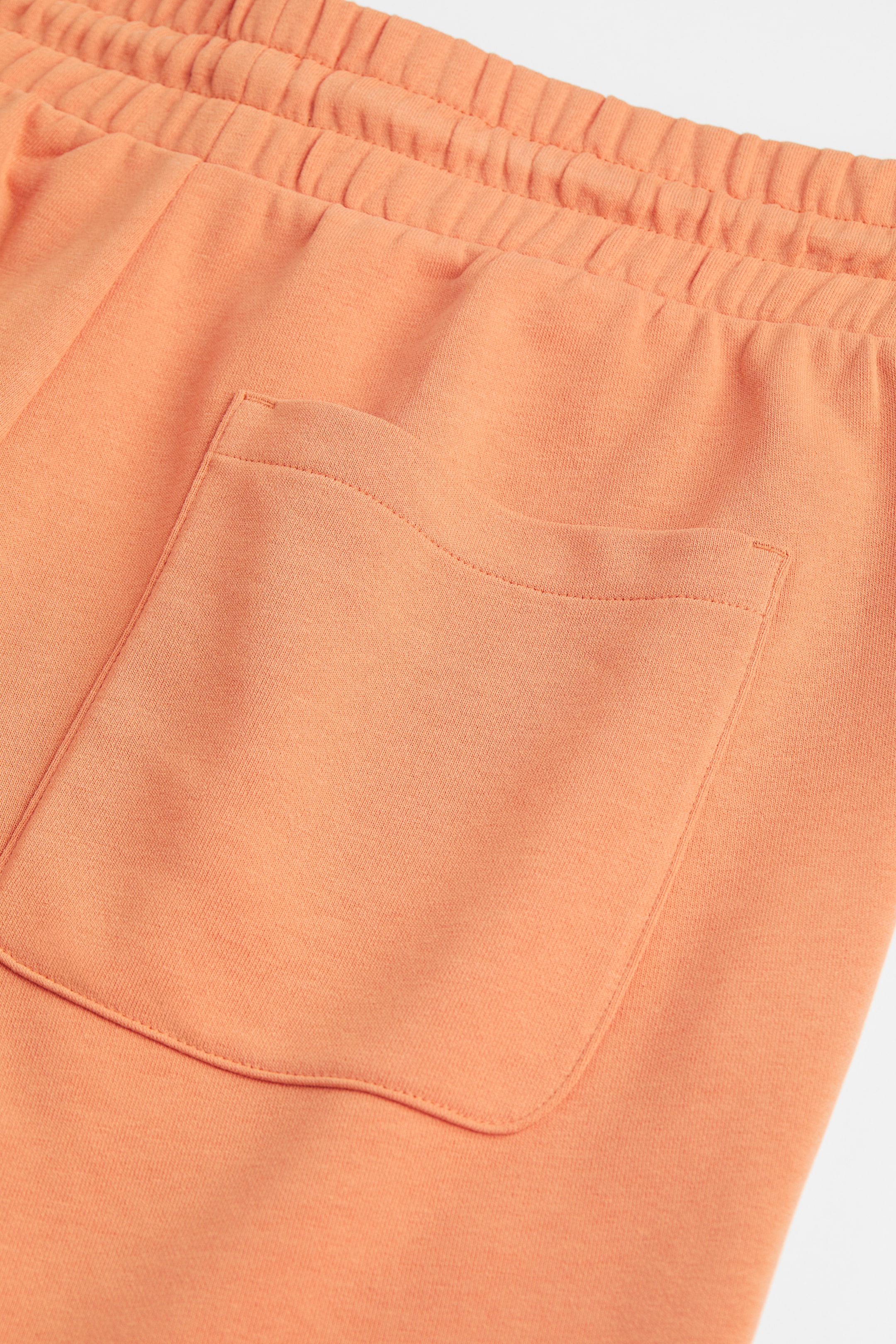 Regular Fit Sweatshorts - Regular waist - Pale orange - Men | H&M GB