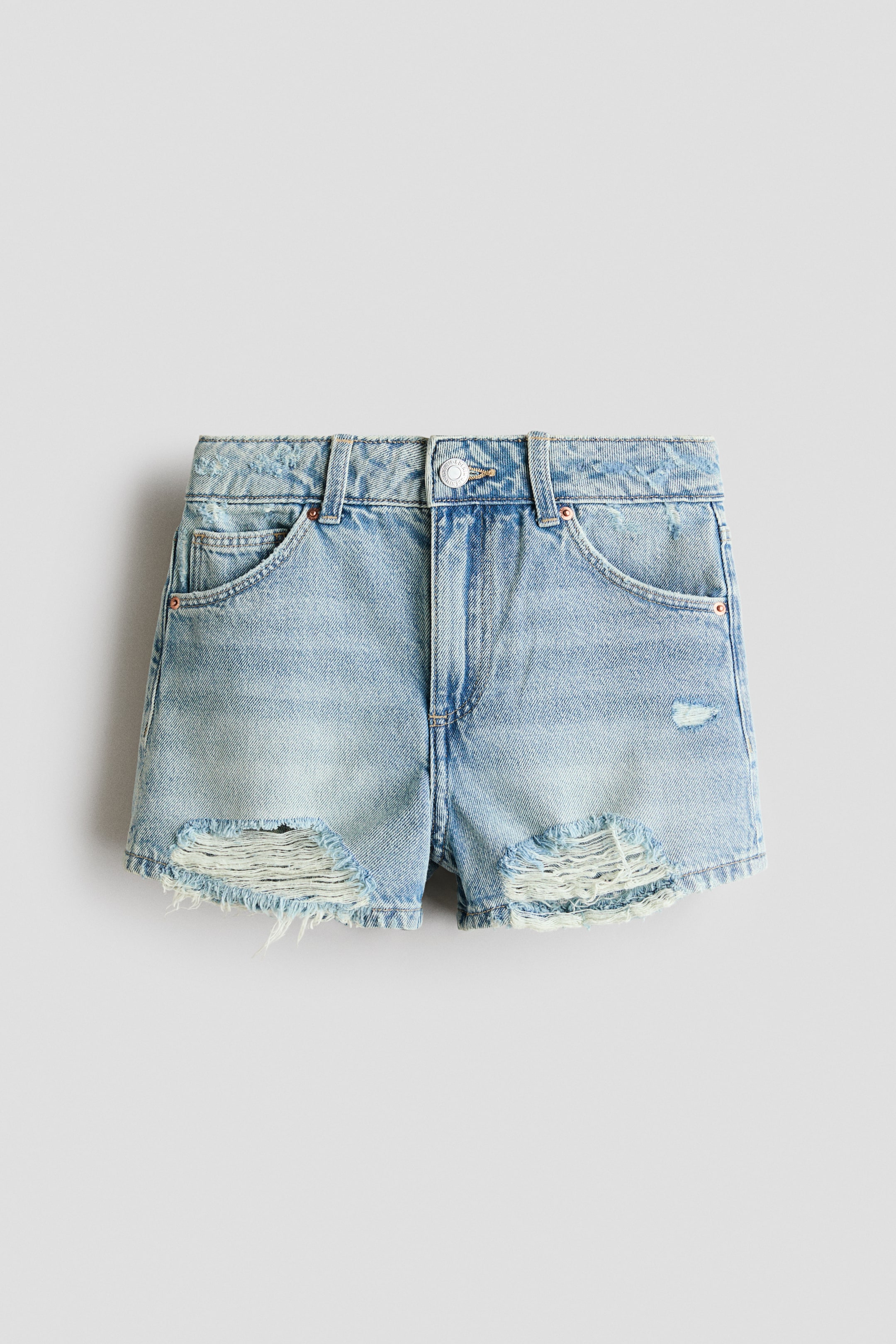 View larger image: These 5-pocket shorts showcase a light wash cotton denim, highlighted in a front view with distressed details and frayed hems. Crafted with a zip fly, button closure, and visible front pockets, including a coin pocket.
