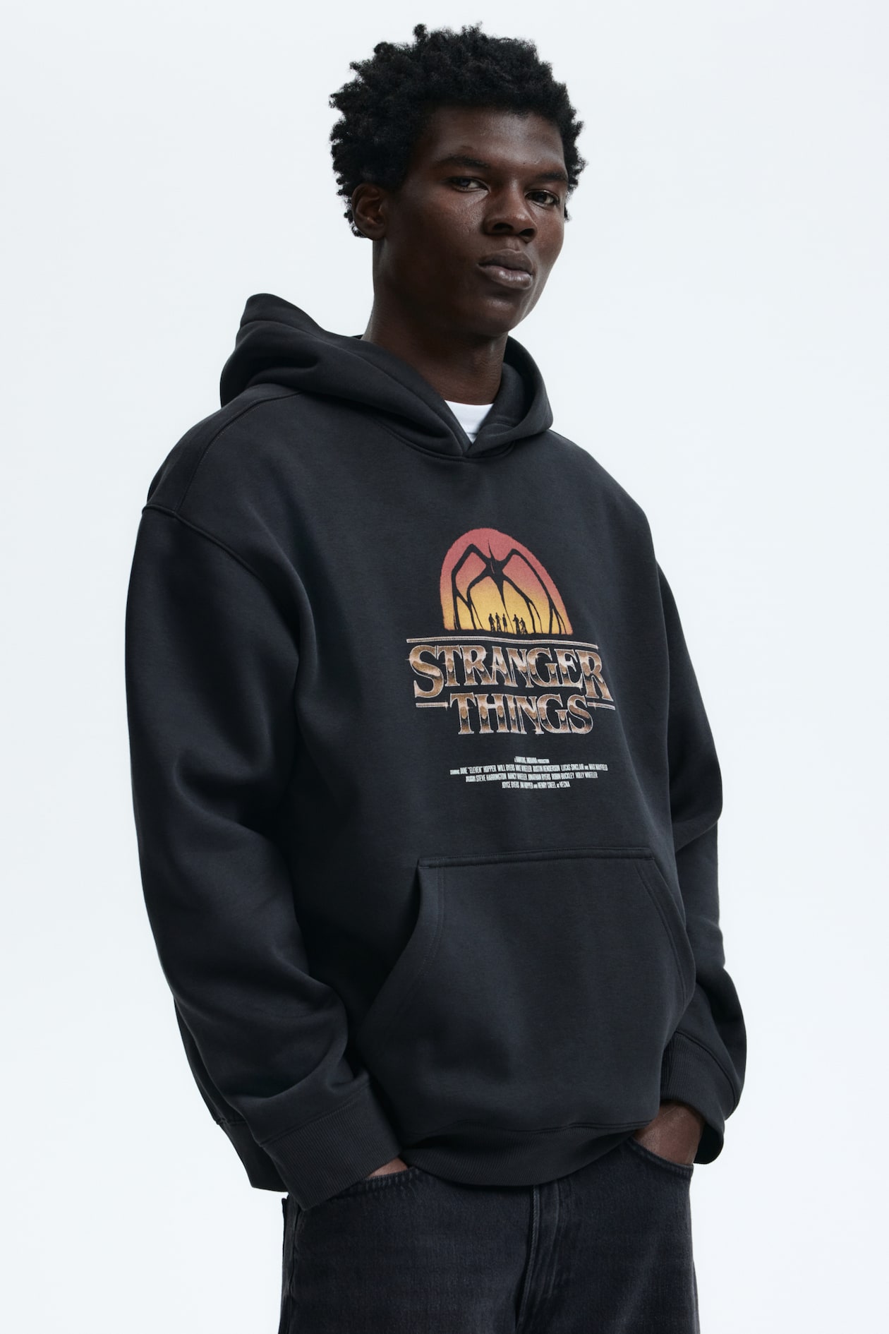 Men's Black/Stranger Things Loose Fit Hoodie | H&M CA