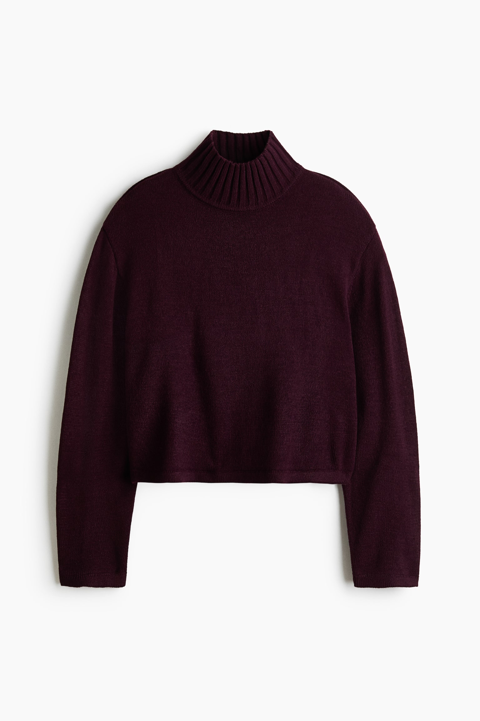A dark burgundy cropped knit jumper is shown from the front, featuring a ribbed mock neck, long sleeves with dropped shoulders, and a straight hem.