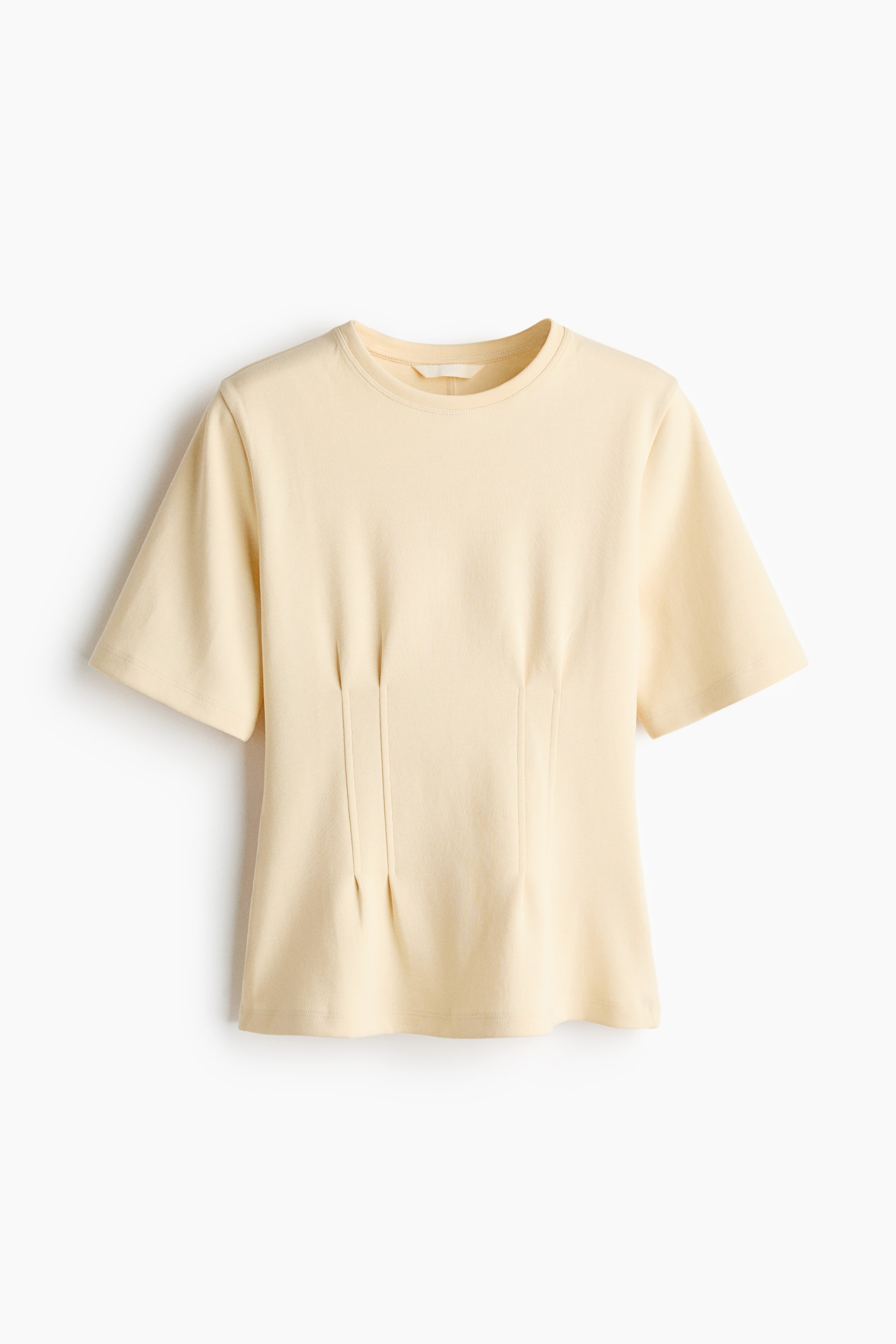 View larger image: A pale yellow long t-shirt crafted from heavy interlock jersey is showcased from the FRONT. It features a round neckline, short sleeves, and two shaping darts at the front of the waist, creating a nipped-in silhouette.