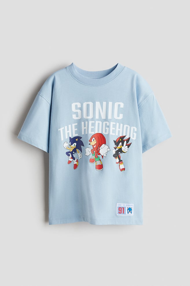 T-shirt oversize imprimé - Bleu clair/Sonic le Hérisson/Bleu marine/Marvel Comics/Gris foncé/Toy Story/Blanc/Stumble Guys/Vert clair/Minions/Gris foncé/Marvel Comics/Vert ancien clair/Minecraft/Blanc/FIFA World Cup 2026™/Blanc/Pokémon/Rouge/Snoopy/Bleu pâle/Mickey/Crème/Bluey/Rouge/Cars/Turquoise clair/Hot Wheels/Bleu vif/Hot Wheels/Gris/Sonic le Hérisson - 1