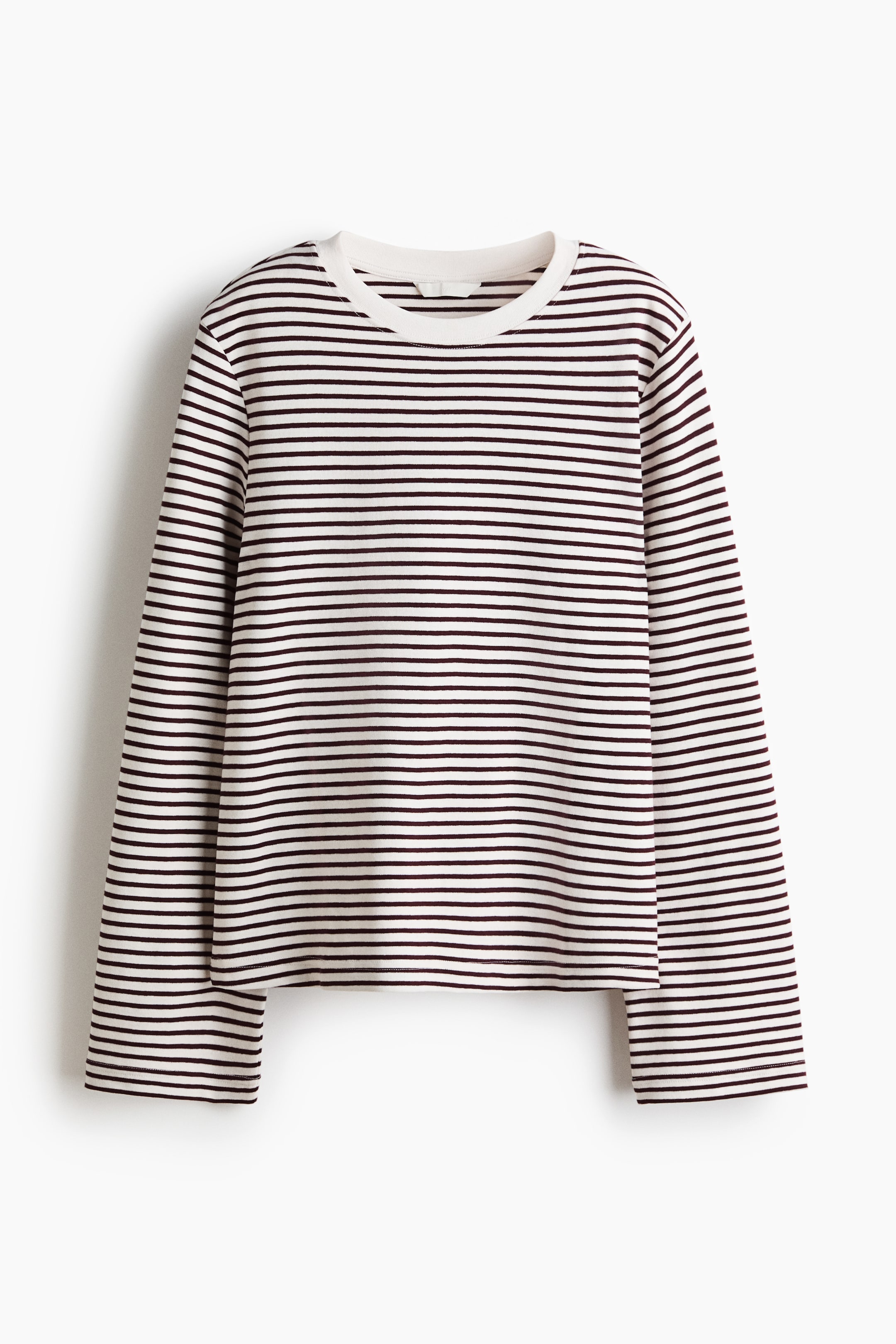 View larger image: A long-sleeve top is laid flat, front-facing, against a white background with thin, horizontal dark stripes. It features a round neckline and long, wide sleeves with neatly finished hems.
