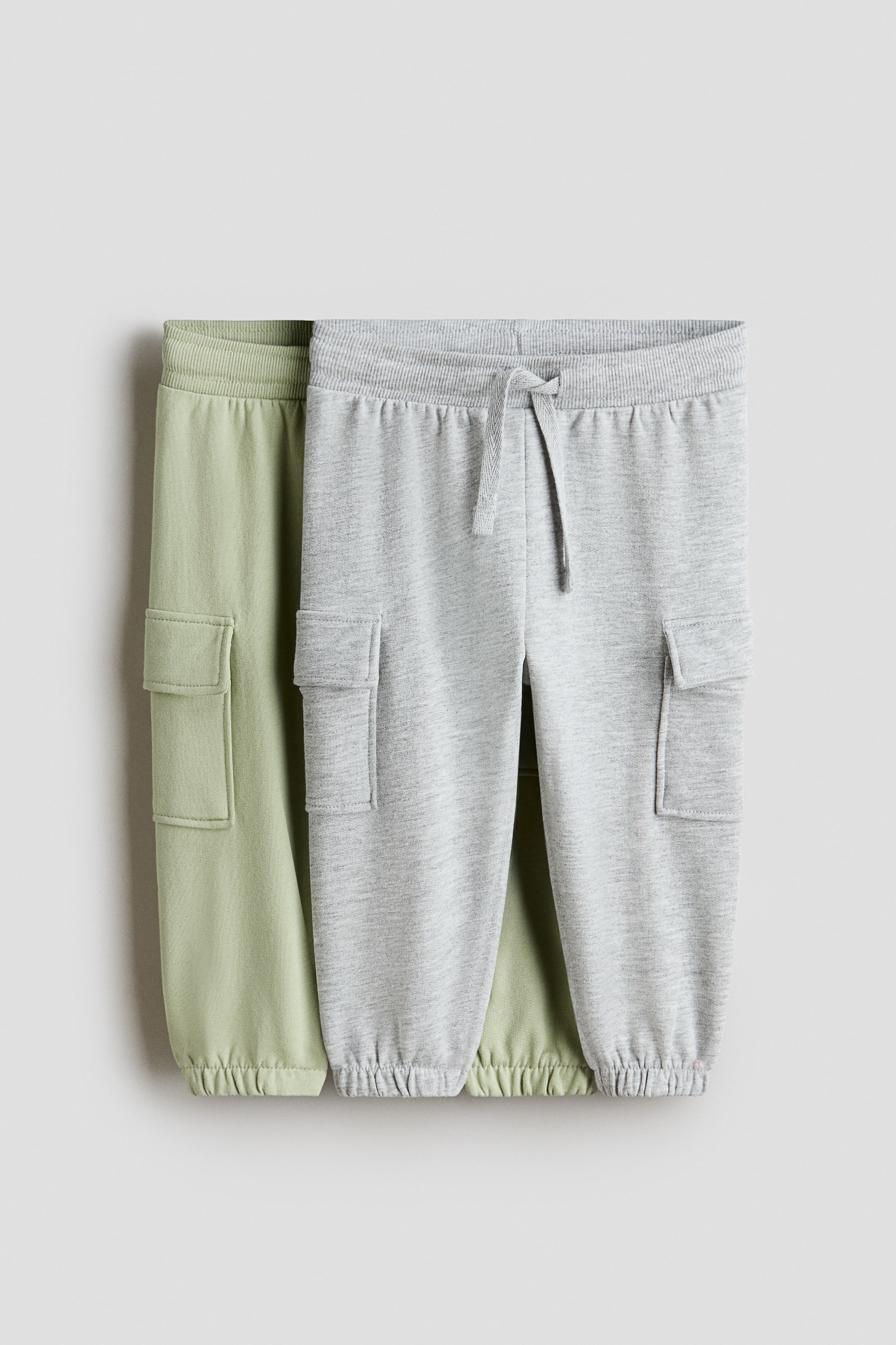 View larger image: 2-pack cargo joggers - Light green/Light grey - Kids | H&M SG 1