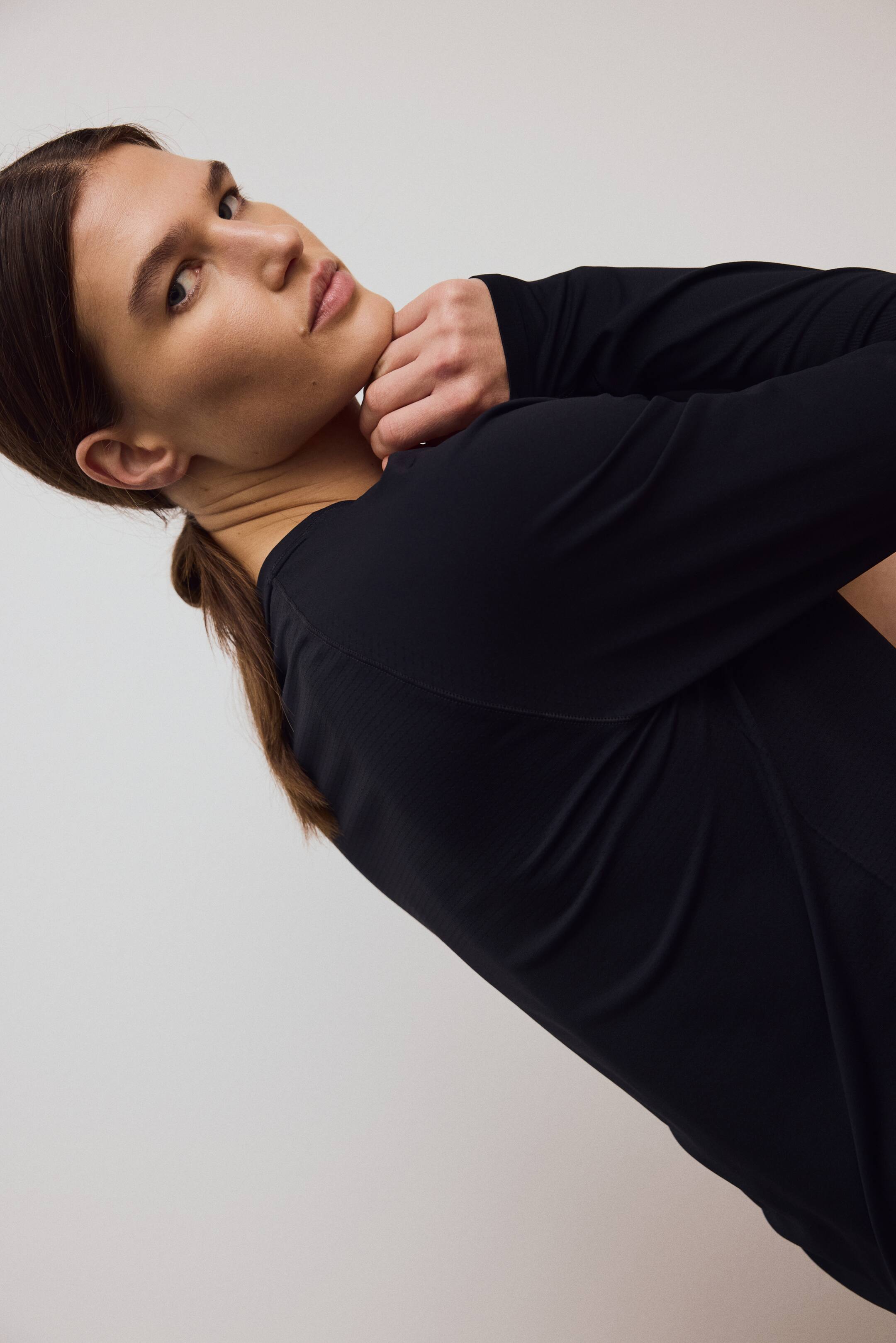 Grotere afbeelding bekijken: Seamless sporttop met DryMove™ - Zwart - DAMES | H&M BE 2