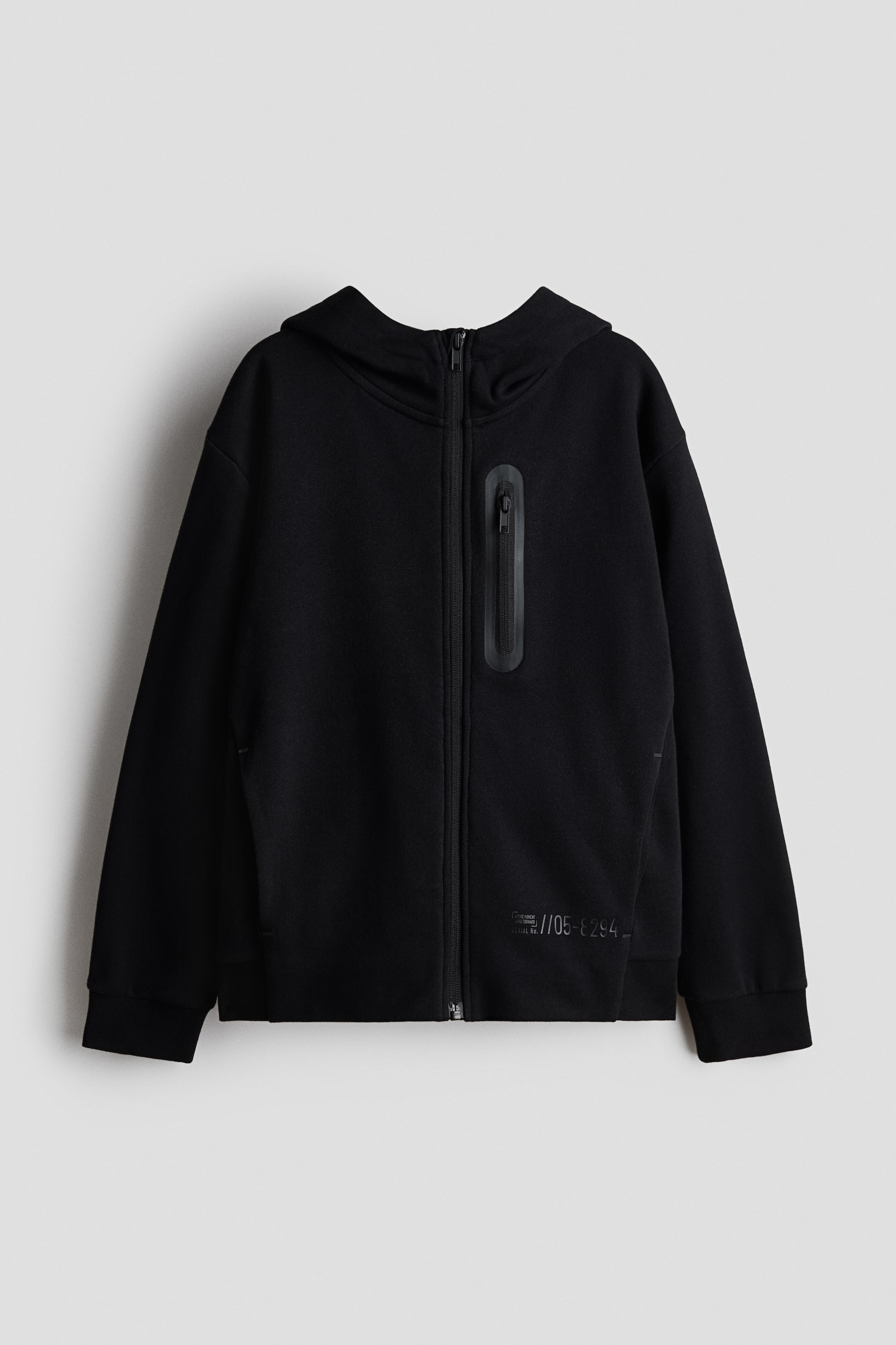 View larger image: Front view of a black hoodie, featuring a full-zip fastening, a hood, and ribbed cuffs and hem. A vertical zipped pocket is visible on the left chest, and a subtle tonal graphic print appears near the bottom-right hem.