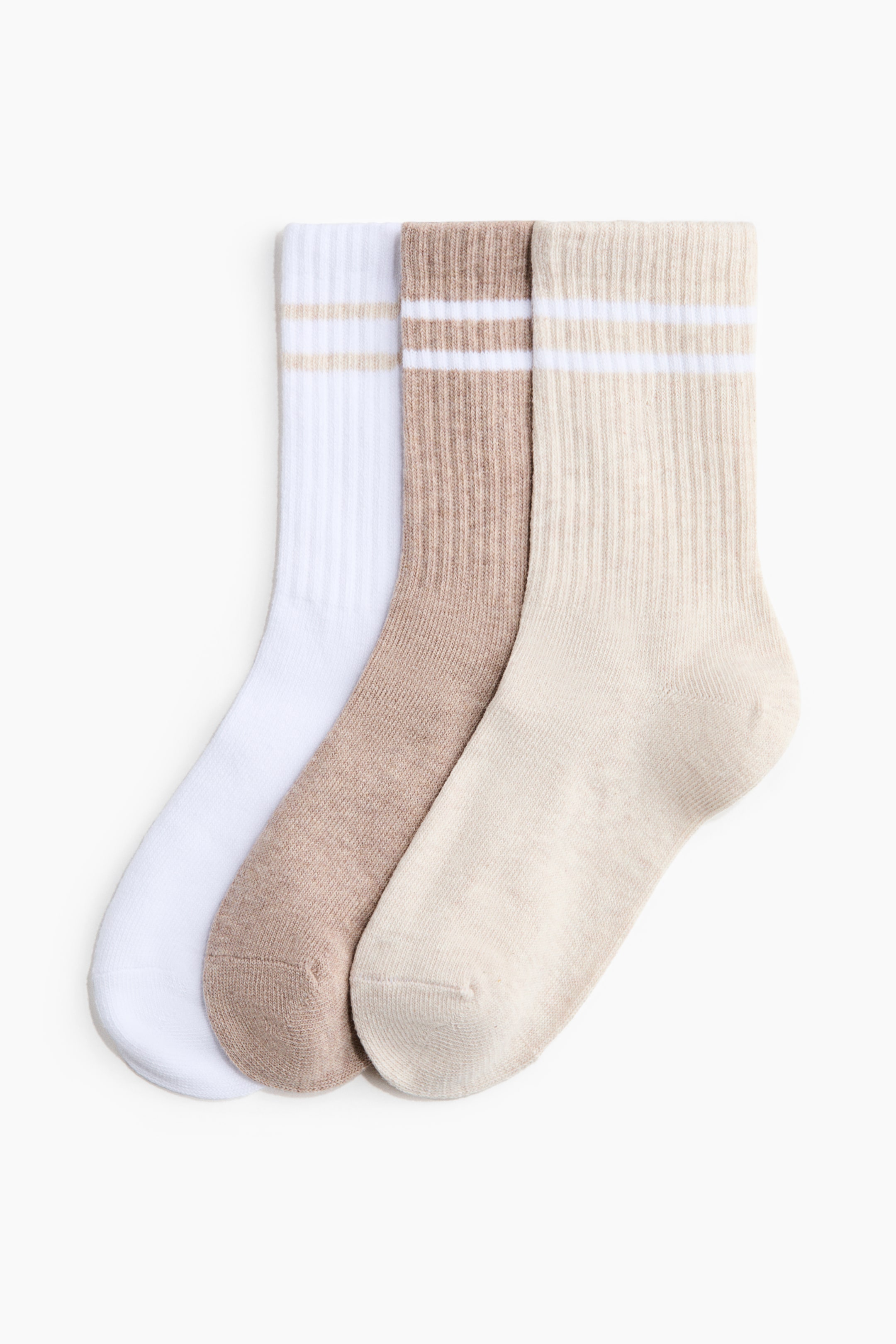 View larger image: A 3-pack of sports socks showcases three crew-cut socks in white, beige, and light beige, each with ribbed legs and two contrasting horizontal stripes near the top.
