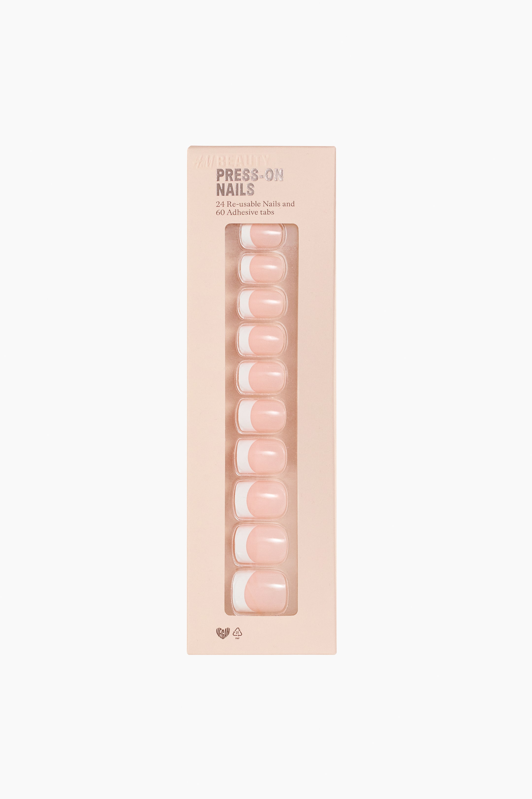 Agrandir l'image: Une vue de face d’une boîte rectangulaire rose clair de faux ongles adhésifs présente, à travers une fenêtre transparente, une colonne verticale de dix faux ongles style French. Les ongles affichent une base rose pâle brillante et translucide, avec des pointes blanches de forme carrée.