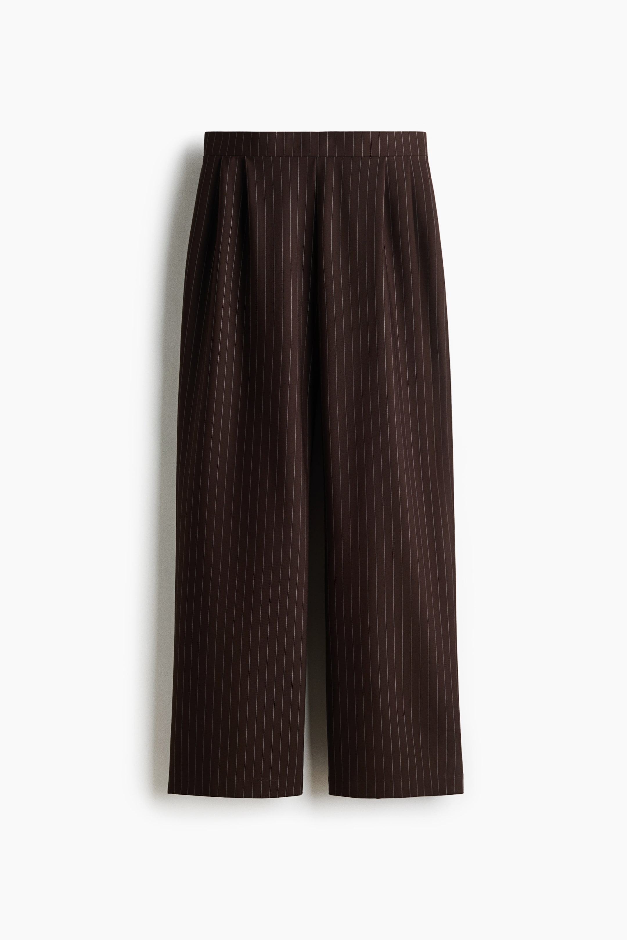 View larger image: Pants, as FRONT, are displaying a dark brown colour with thin, light-coloured vertical pinstripes. They are featuring a flat waistband with front pleats and a wide-leg silhouette.