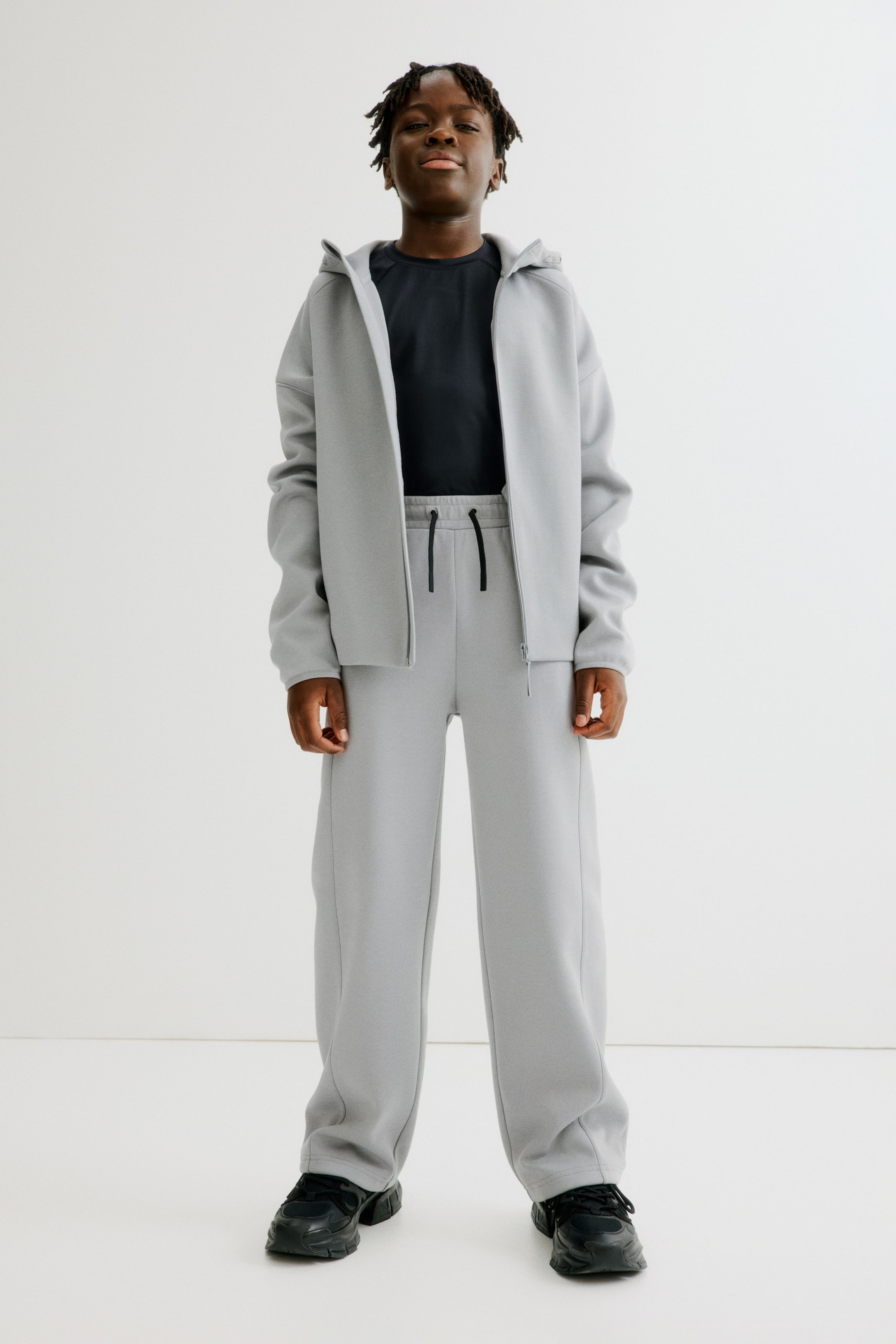 Ampliar la imagen: Relaxed Fit Sports joggers with DryMove™ - Gris claro - Kids | H&M MX 2