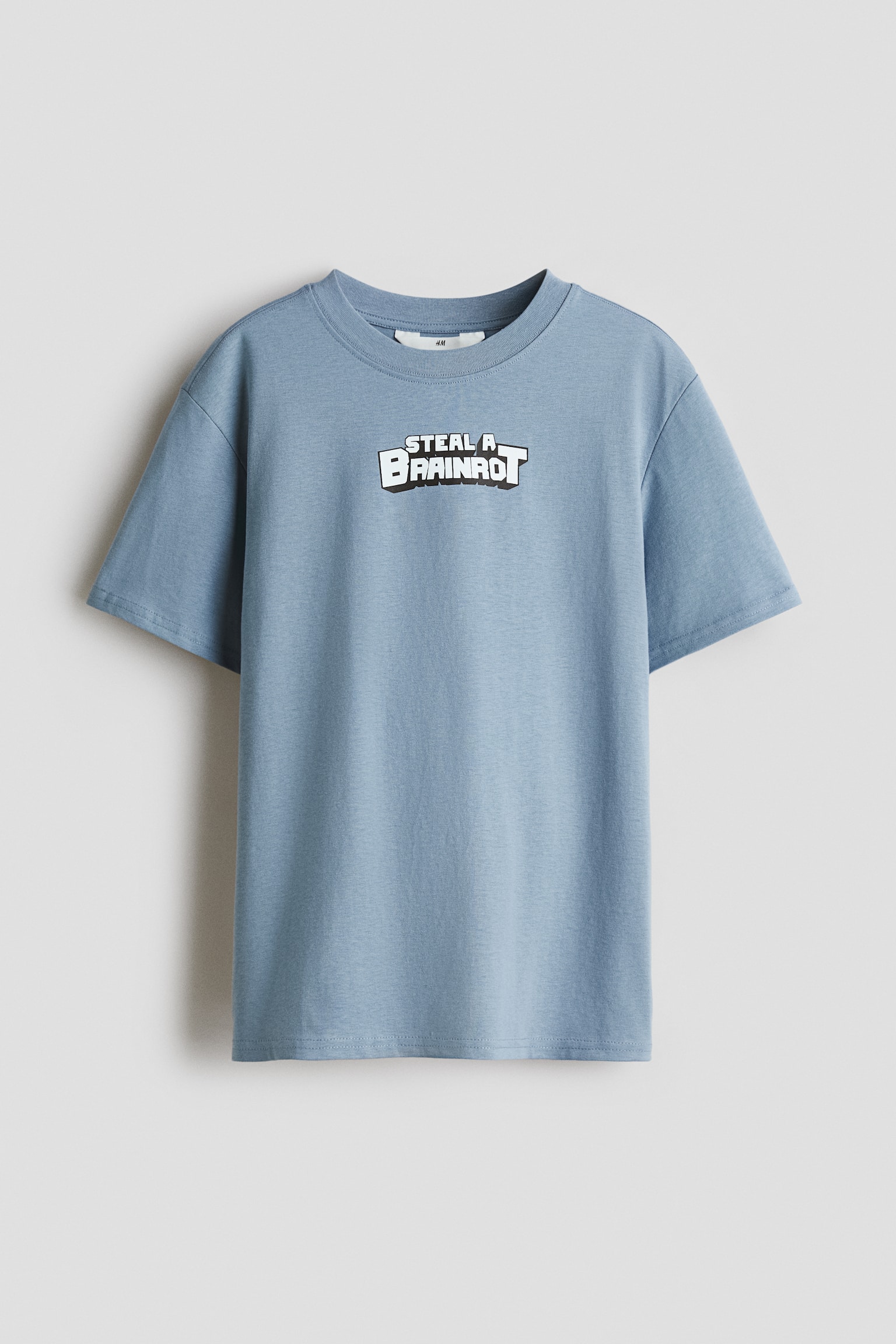 Mønstret T-shirt - Tåkeblå/Steal a Brainrot/Grå/UEFA Champions League®/Lys tåkegrønn/Minecraft/Hvit/SmileyWorld®/Lys gråmelert/Minecraft/Sort/Stranger Things/Mørk grønn/Fortnite/Mørk brun/Pusur/Hvit/Pokémon/Turkis/Pusur/Hvit/Pusur/Hvit/Steal a Brain Rot/Lys blå/Simpsons
