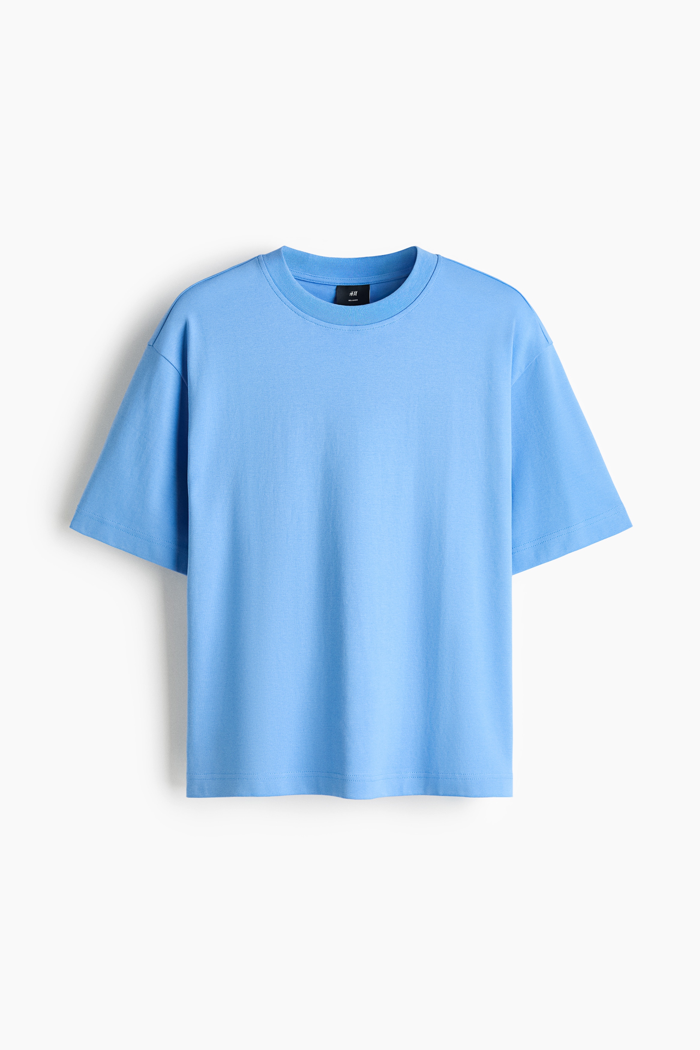 ÎÎ½Î± Î±Î½Î¿Î¹ÏÏÏ Î³Î±Î»Î¬Î¶Î¹Î¿ Î²Î±Î¼Î²Î±ÎºÎµÏÏ interlock jersey T-shirt ÏÎ¿ÏÎ¹Î­ÏÎ±Î¹ Î±ÏÏ ÏÎ¿ Î¼Î¿Î½ÏÎ­Î»Î¿, Î¼Îµ relaxed fit, ÏÏÏÎ¿Î³Î³ÏÎ»Î® Î»Î±Î¹Î¼ÏÎºÎ¿ÏÎ· Î¼Îµ rib ÏÎµÎ»ÎµÎ¯ÏÎ¼Î± ÎºÎ±Î¹ ÏÎ±Î¼Î·Î»ÏÎ¼Î­Î½Î¿ÏÏ ÏÎ¼Î¿ÏÏ. Î¤Î¿ T-shirt Î´Î¹Î±Î¸Î­ÏÎµÎ¹ Î¯ÏÎ¹Î¿ ÏÎµÎ»ÎµÎ¯ÏÎ¼Î± ÎºÎ±Î¹ ÏÏÎ½Î´ÏÎ¬Î¶ÎµÏÎ±Î¹ Î¼Îµ ÏÎºÎ¿ÏÏÎ¿ Î³ÎºÏÎ¹ ÏÎ±Î½ÏÎµÎ»ÏÎ½Î¹.