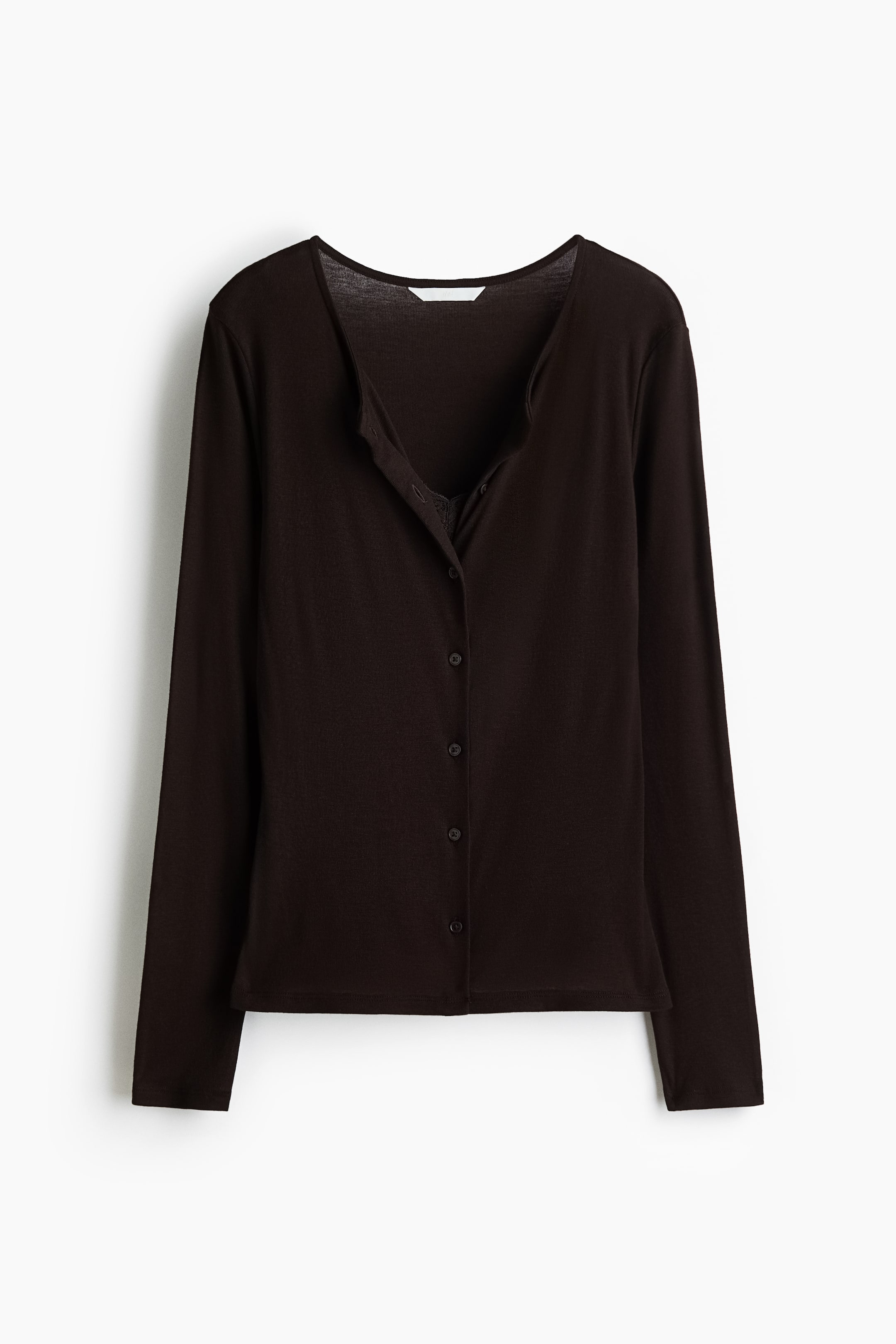 View larger image: The front of a dark brown fitted cardigan in soft jersey is shown, featuring a round neckline and buttons down the centre. A sewn-in front panel resembles a strappy top with a lace-trimmed V-neckline, creating a layered look when the cardigan is unbuttoned.