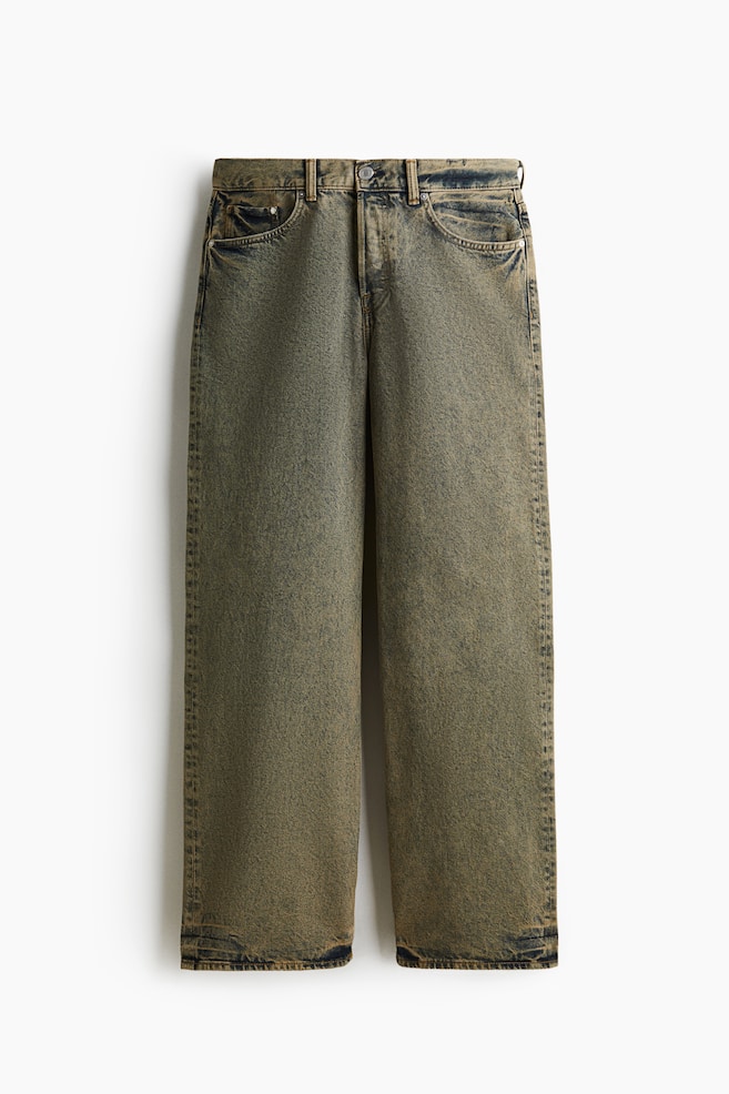 The FRONT of a pair of acid-washed jeans is showcasing a loose, straight-leg fit with extra room around the leg. The rigid cotton denim is featuring a regular waist, front slash pockets, a coin pocket, and a visible button fly, all in a distressed olive green and brown wash. - 1