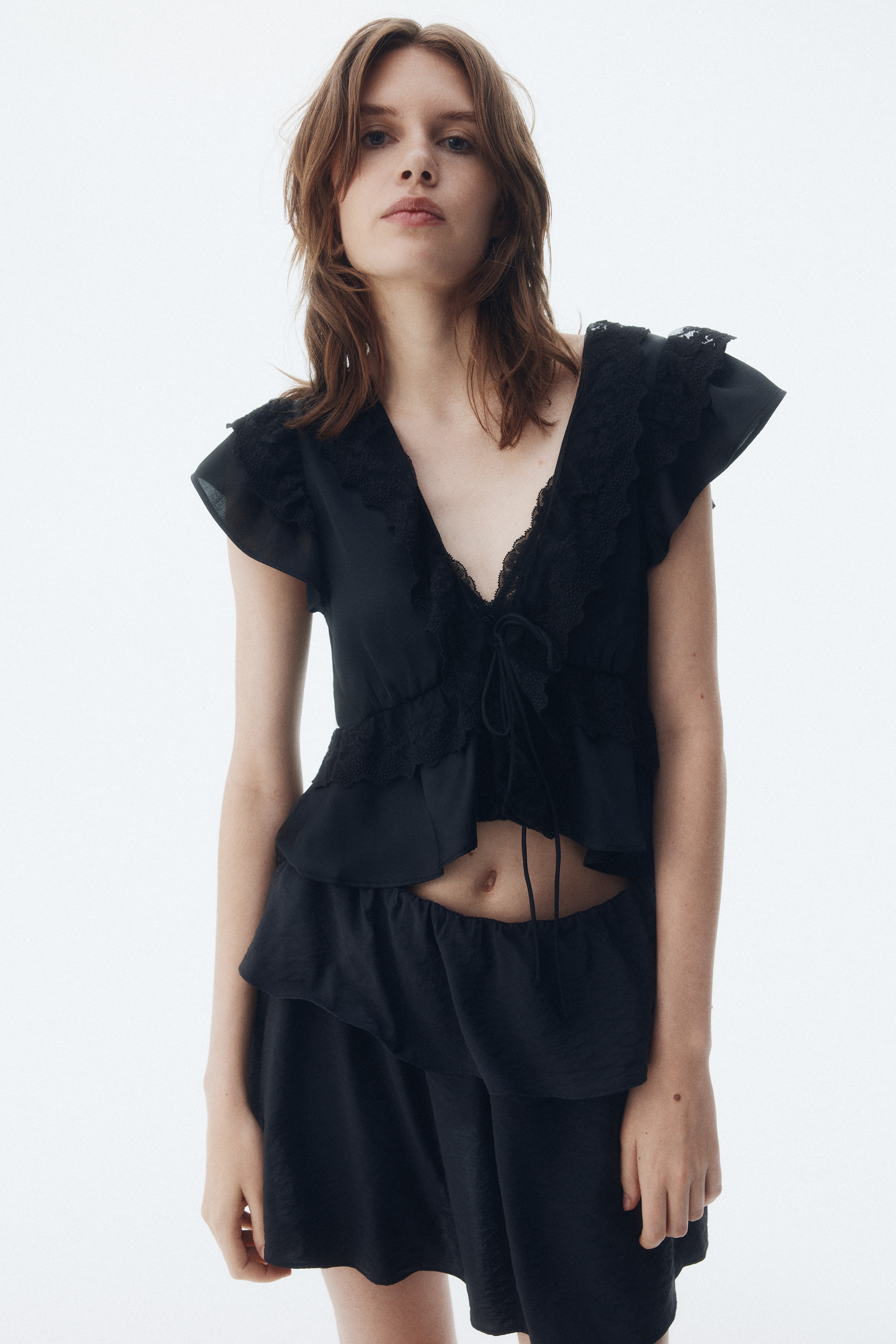 Flounce-trimmed satin blouse