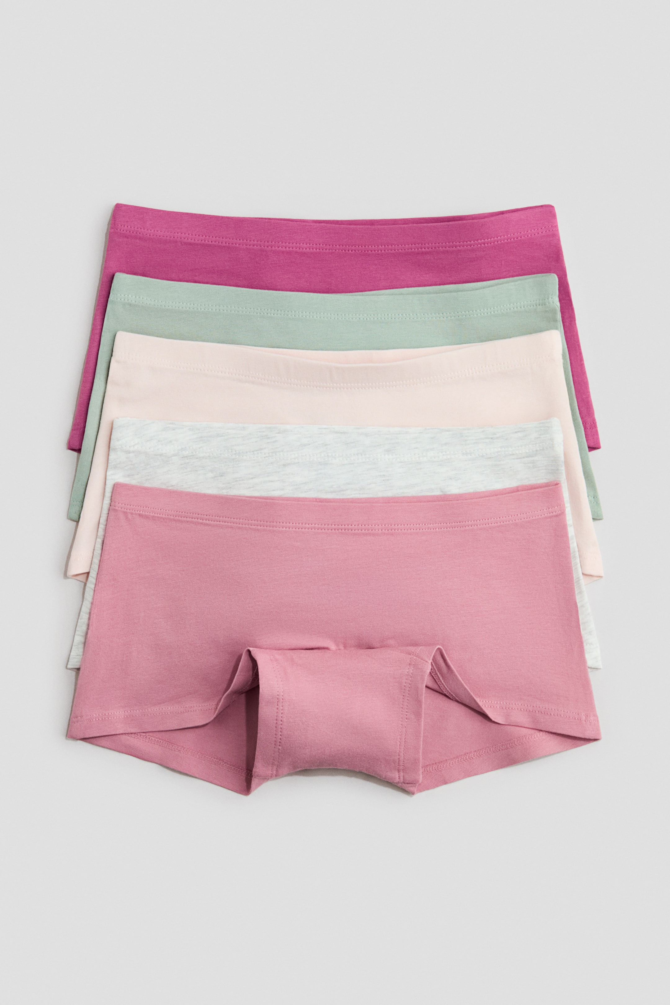 View larger image: Cotton jersey boxer briefs are neatly stacked, displaying their front view. Each pair features an elasticated waistband and a lined crotch, available in a range of pastel shades.