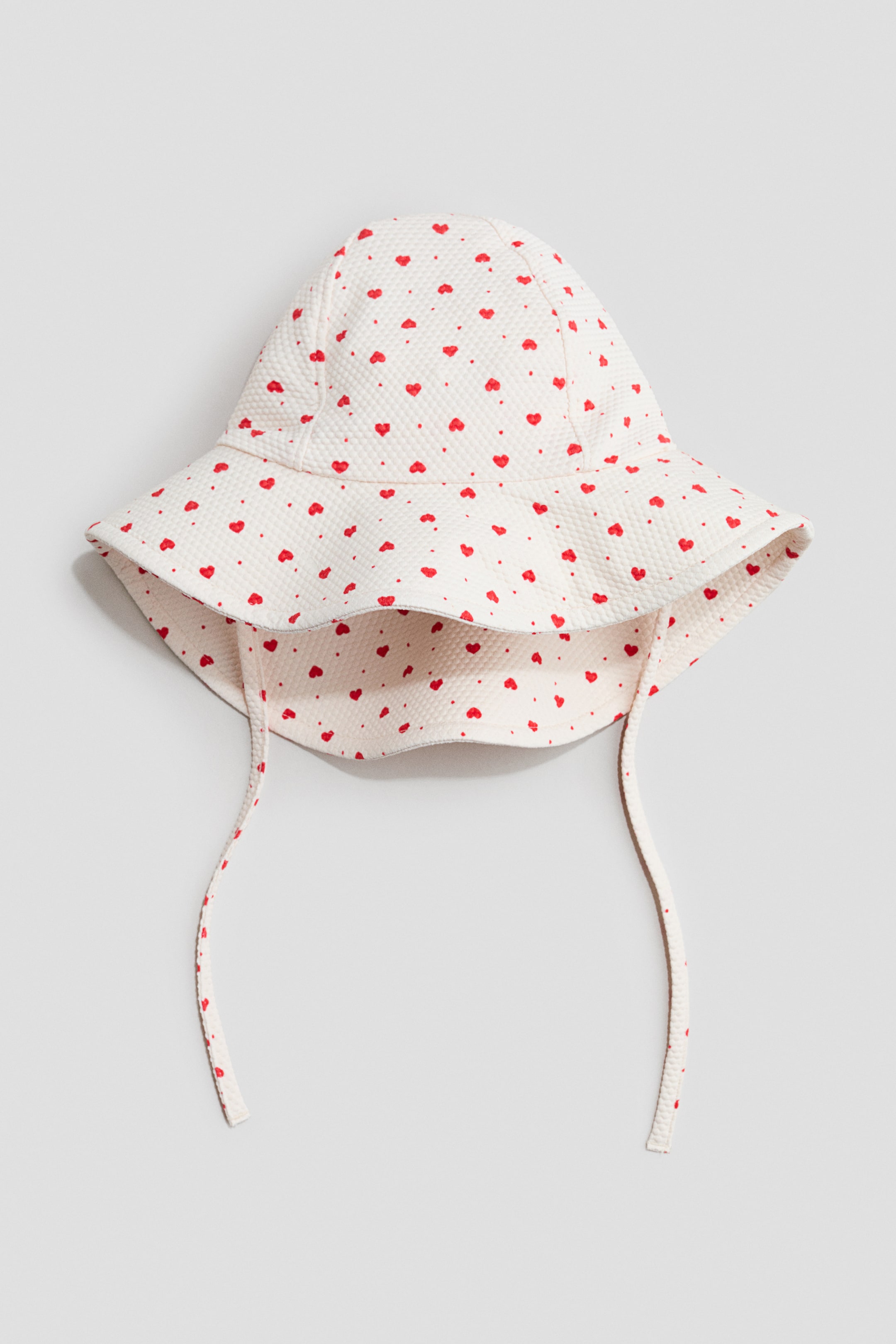 Zobacz większy obraz: Czapka przeciwsłoneczna UPF 50 - Jasnobeżowy/Serca - Dziecko | H&M PL 1