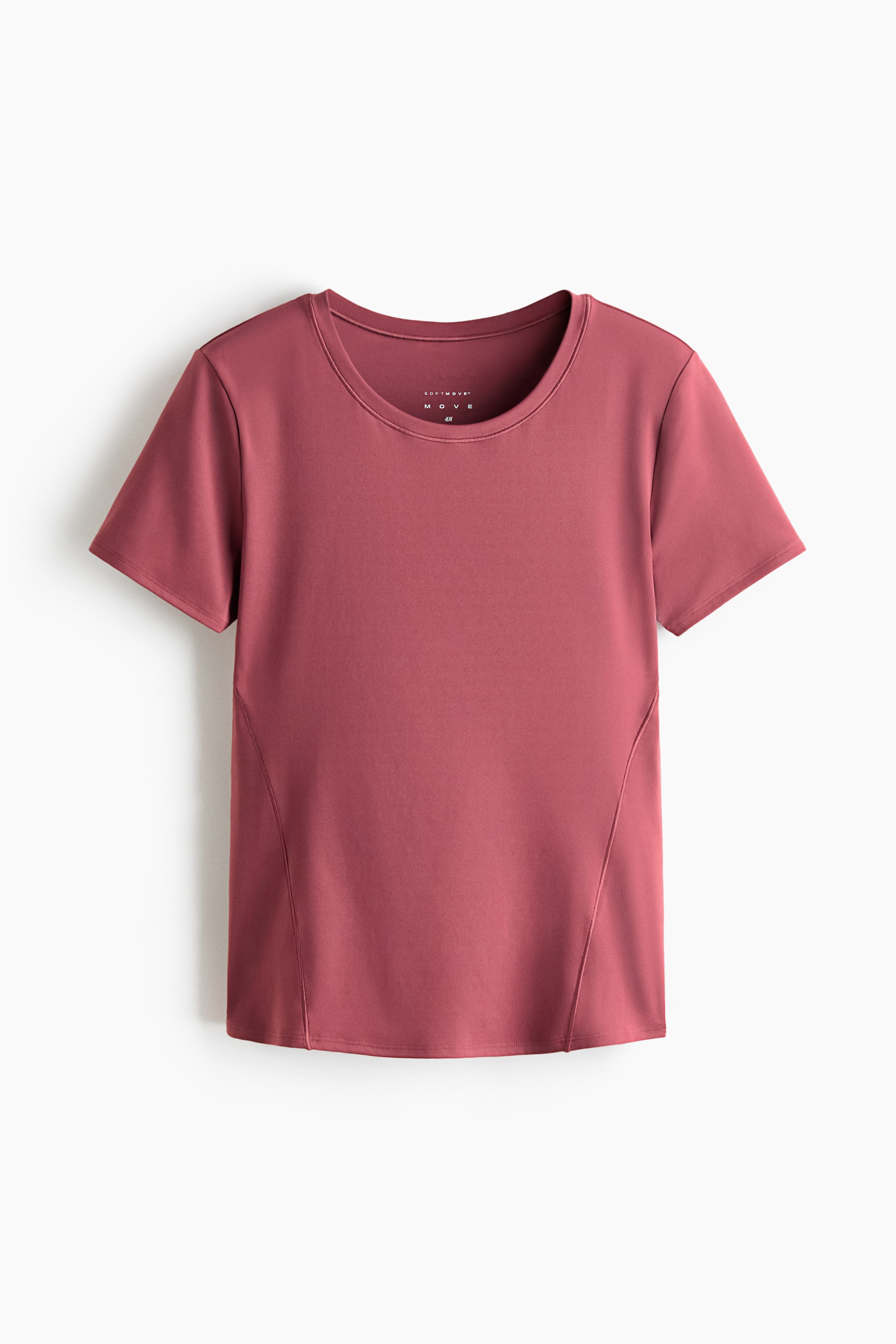 Ver imagen más grande: Un top deportivo con DryMove? se presenta al frente, con cuello redondo y mangas cortas. Es de color rosa empolvado, mostrando costuras laterales anguladas que se extienden desde la axila hasta el dobladillo.
