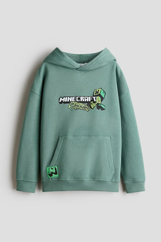 Brushed-inside printed hoodie - Green/Minecraft/Black/PlayStation/Cream/UEFA Champions League®/Dusty blue/SmileyWorld®/Khaki green/SpongeBob/Turquoise/SpongeBob/Dark turquoise/Fortnite/Light beige/Minions/Turquoise/SmileyWorld® - 1