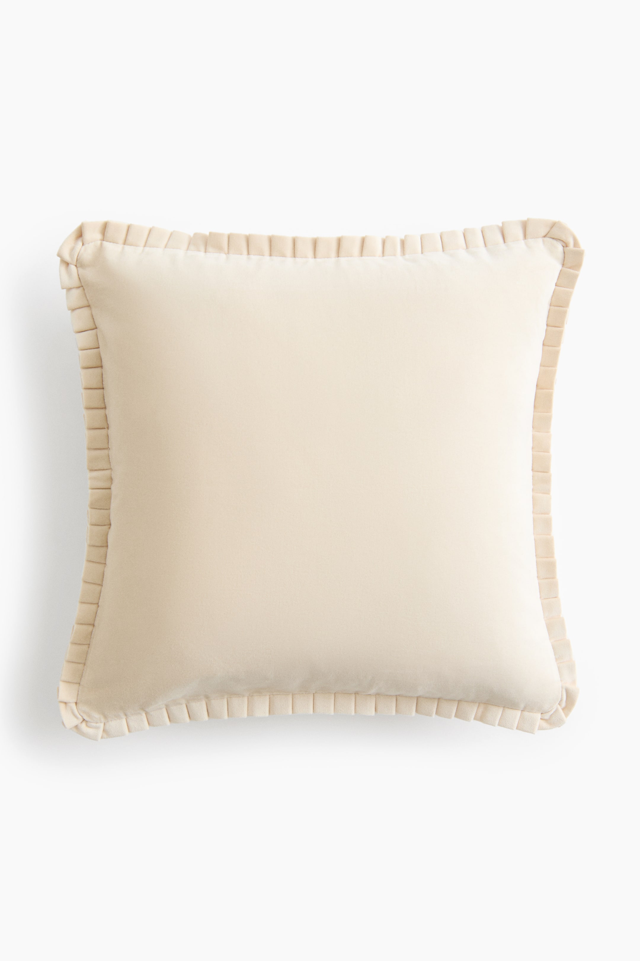 View larger image: A square cream-colored velvet pillow is shown from the front, featuring a smooth, soft-textured body and a pleated ruffle trim running along all four edges.