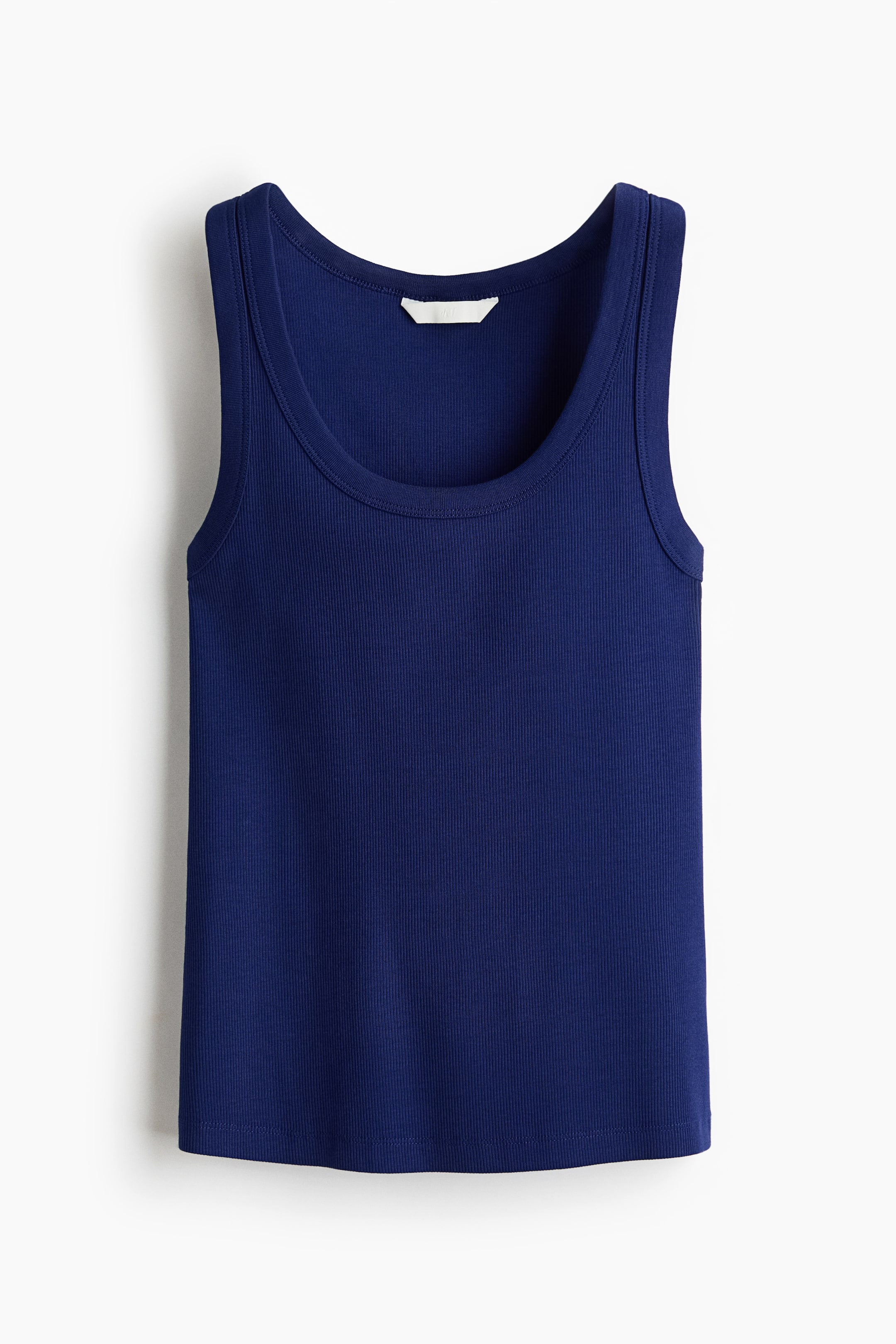 View larger image: A fitted navy blue tank top is displayed from the front. It features a ribbed cotton jersey fabric, a scoop neckline, and wide shoulder straps.