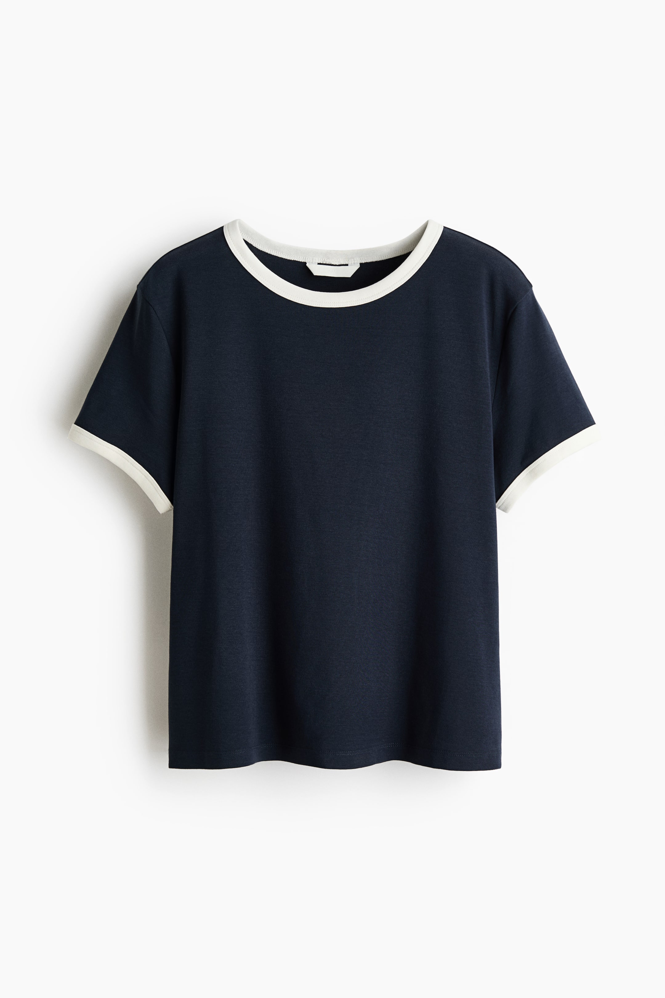 View larger image: A fitted navy blue t-shirt is shown from the front, featuring a round neckline and short sleeves, both with off-white contrasting trims. It is finished with a straight-cut hem.