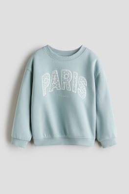 Sweatshirt med borstad insida och motiv