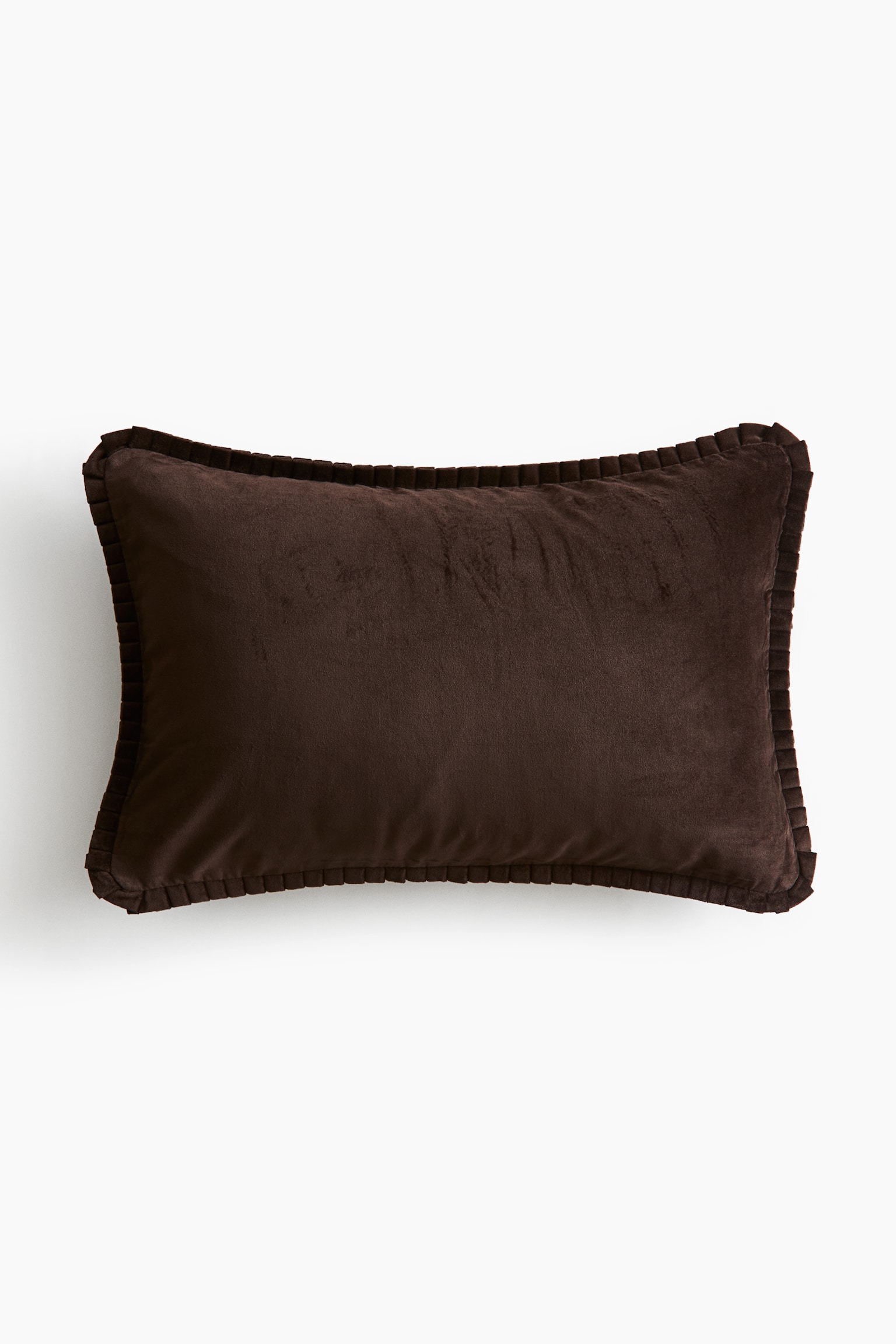 A rectangular cushion cover in dark brown velvet is facing forward, featuring a soft, plush texture and a matching pleated border running along the edges.