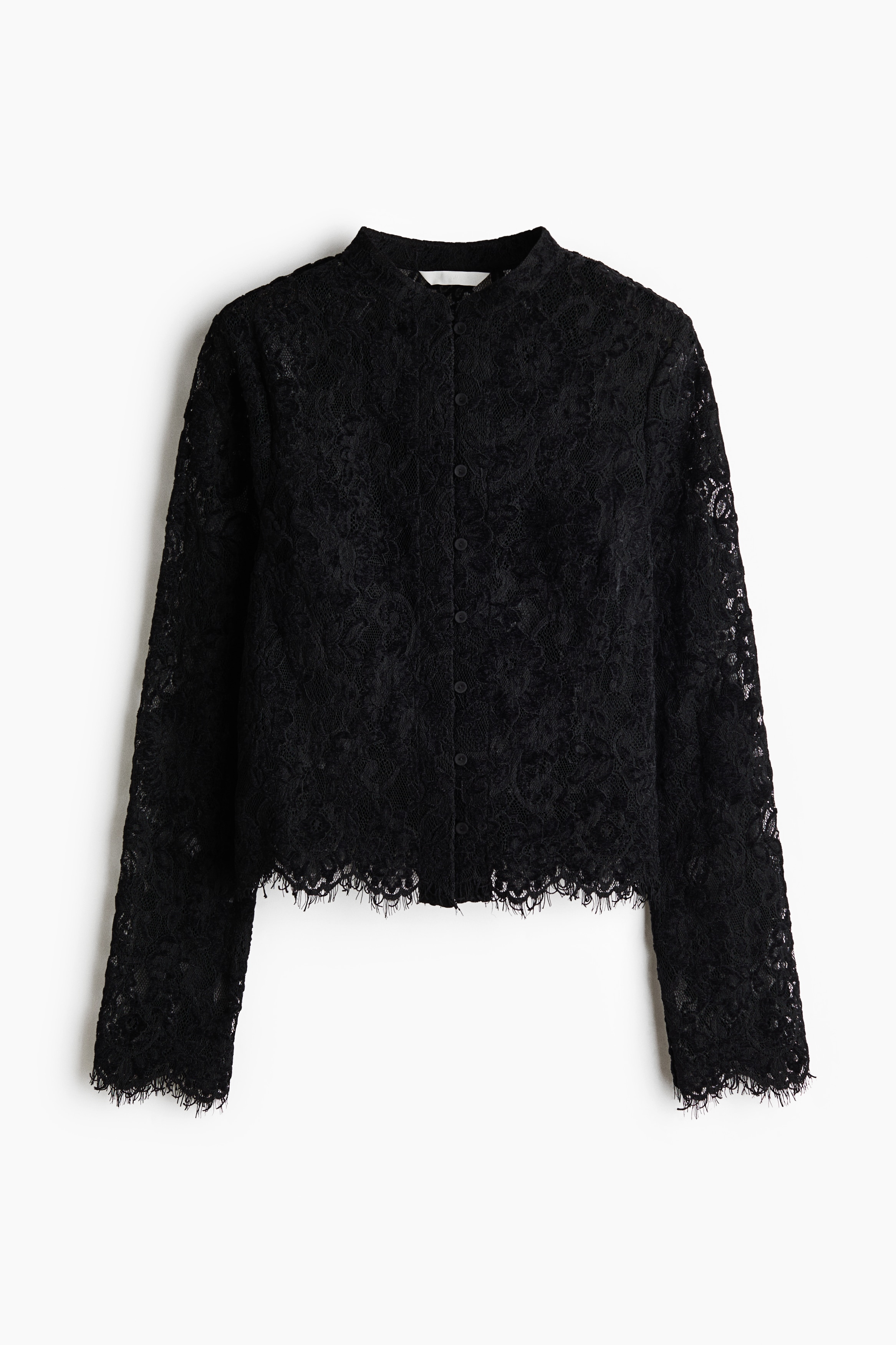 A lace top featuring a band collar and button-front fastening is being worn by the model. The top is made of a semi-sheer, dark floral lace pattern.